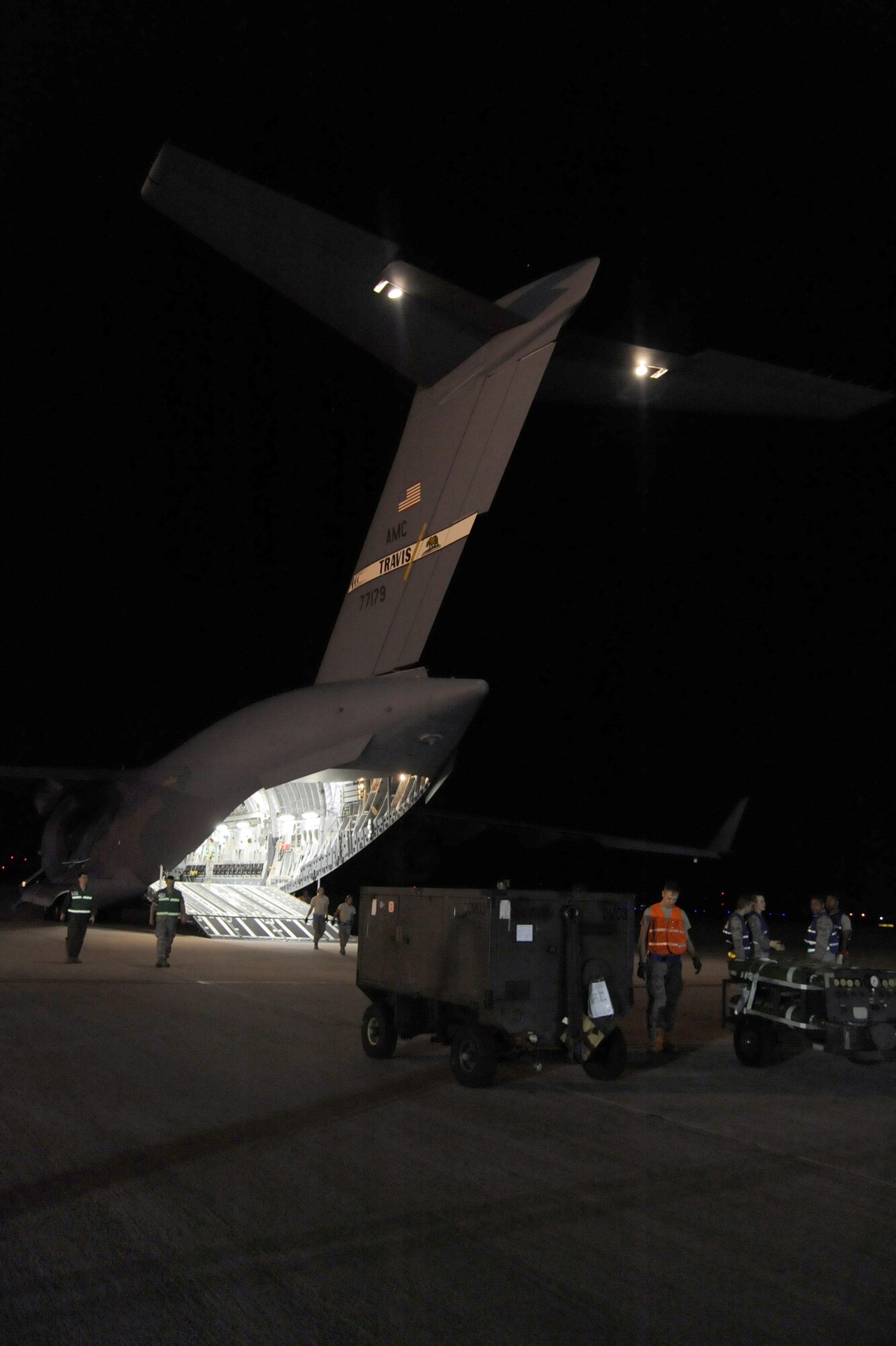 Equipment is staged to be loaded into a C-17 Globemaster III that will be flown to support Operation Odyssey Dawn March 20, 2011, McConnell Air Force Base, Kan. Joint Task Force Odyssey Dawn is the U.S. Africa Command task force established to provide operational and tactical command and control of U.S. military forces supporting the international response to the unrest in Libya and enforcement of United Nations Security Council Resolution 1973. UNSCR 1973 authorizes all necessary measures to protect civilians in Libya under threat of attack by Qadhafi regime forces. (U.S. Air Force photo/ Staff Sgt. Dallas Edwards)