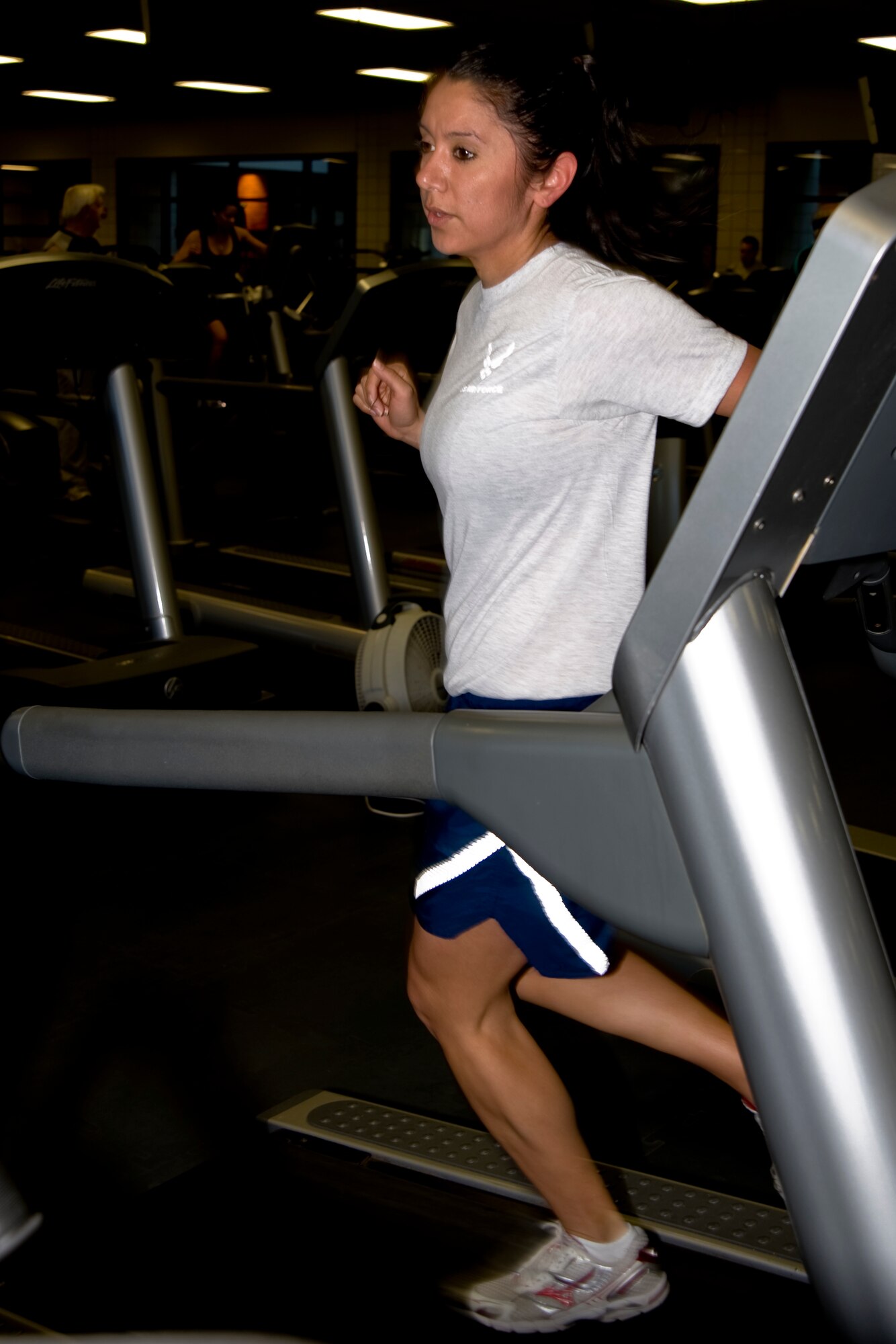 Staff Sgt. Kathryn Trinidad, 22nd Operation Group analyst, runs at the fitness center March 23, 2011, McConnell Air Force Base, Kan. Sergeant Trinidad arrived at McConnell in “the best shape of her life.” However, she soon ignored her fitness and nutrition, leading to a downward spiral. She made a change for herself using her wingmen’s help. (U.S. Air Force photo/Airman 1st Class Armando A. Schwier-Morales) 