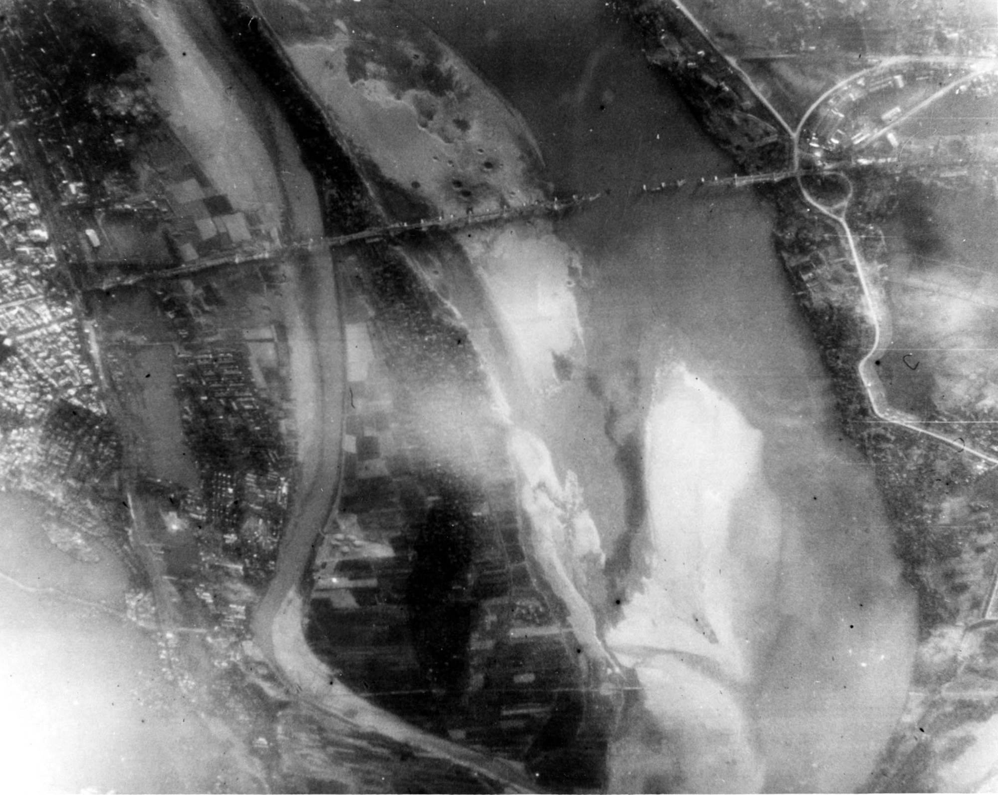 Aerial reconnaissance photograph of the famous Paul Doumer Bridge, located just outside of Hanoi, after laser-guided munitions destroyed it. (U.S. Air Force photo)