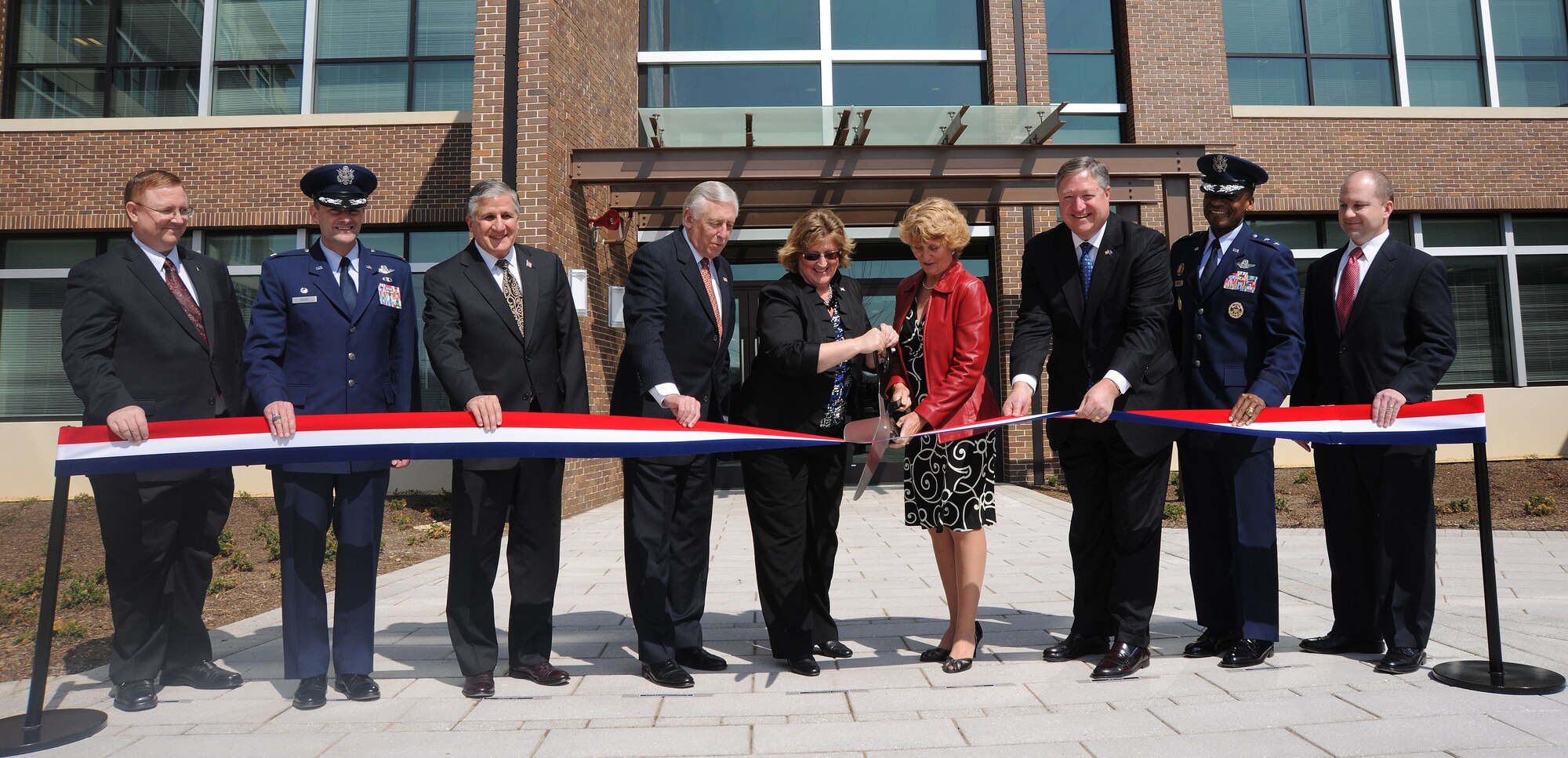 (From the left to the right) Mr. Terry Edwards, Air Force Center of Engineering and Environment, Colonel Ken Rizer, 11th Wing/Joint Base Andrews commander, Mr. Robert E. Corsi, Jr., Deputy Administrative Assistant to the Secretary of the Air Force, Representative Steny Hoyer, 5th Congressional District of Maryland, Elizabeth Jones and Anne Gilfillan, daughters of the building's namesake, the Honorable Michael B. Donley, Secretary of the Air Force, Maj. Gen. Darren McDew, Air Force District of Washington commander, and Mr. Timothy Wall, President of CDM Federal Programs Corporation, cut a ribbon signifying the dedication of the new Colonel William Atkinson Jones III building at Joint Base Andrews March 22, 2011. "The Jones Building" is a made from 20 percent recycled material and features a storm water recycling system and green roof, which will help power the energy efficient building while saving the Air Force 44.7 percent annually over the building it is replacing.  An air commando and A-1H Skyraider pilot, Colonel Jones was a hero of the Vietnam War and a Medal of Honor recipient. (U.S. Air Force photo by Senior Airman Melissa V. Brownstein)