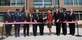 (From the left to the right) Mr. Terry Edwards, Air Force Center of Engineering and Environment, Colonel Ken Rizer, 11th Wing/Joint Base Andrews commander, Mr. Robert E. Corsi, Jr., Deputy Administrative Assistant to the Secretary of the Air Force, Representative Steny Hoyer, 5th Congressional District of Maryland, Elizabeth Jones and Anne Gilfillan, daughters of the building's namesake, the Honorable Michael B. Donley, Secretary of the Air Force, Maj. Gen. Darren McDew, Air Force District of Washington commander, and Mr. Timothy Wall, President of CDM Federal Programs Corporation, cut a ribbon signifying the dedication of the new Colonel William Atkinson Jones III building at Joint Base Andrews March 22, 2011. "The Jones Building" is a made from 20 percent recycled material and features a storm water recycling system and green roof, which will help power the energy efficient building while saving the Air Force 44.7 percent annually over the building it is replacing.  An air commando and A-1H Skyraider pilot, Colonel Jones was a hero of the Vietnam War and a Medal of Honor recipient. (U.S. Air Force photo by Senior Airman Melissa V. Brownstein)