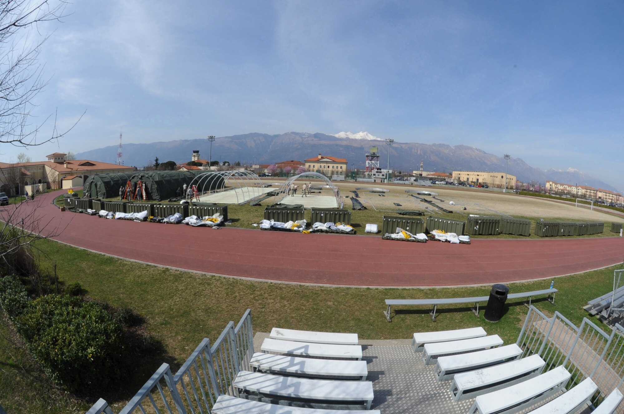 Alaskan small shelter tents line the Dragon Fitness Center sports field on Aviano Air Base, Italy, to house contingency personnel arriving in support of Operation Odyssey Dawn, March 22, 2011. Joint Task Force Odyssey Dawn is the U.S. Africa Command task force established to support the larger international response to the unrest in Libya. A broad coalition of nations are partnering to enforce U.N. Security Council Resolution (UNSCR) 1973, which authorizes all necessary means to protect civilians in Libya under threat of attack by Qadhafi regime forces.  JTF Odyssey Dawn is commanded by Admiral Samuel J. Locklear, III. (U.S. Air Force photo/ Staff Sgt. Nadine Y. Barclay)