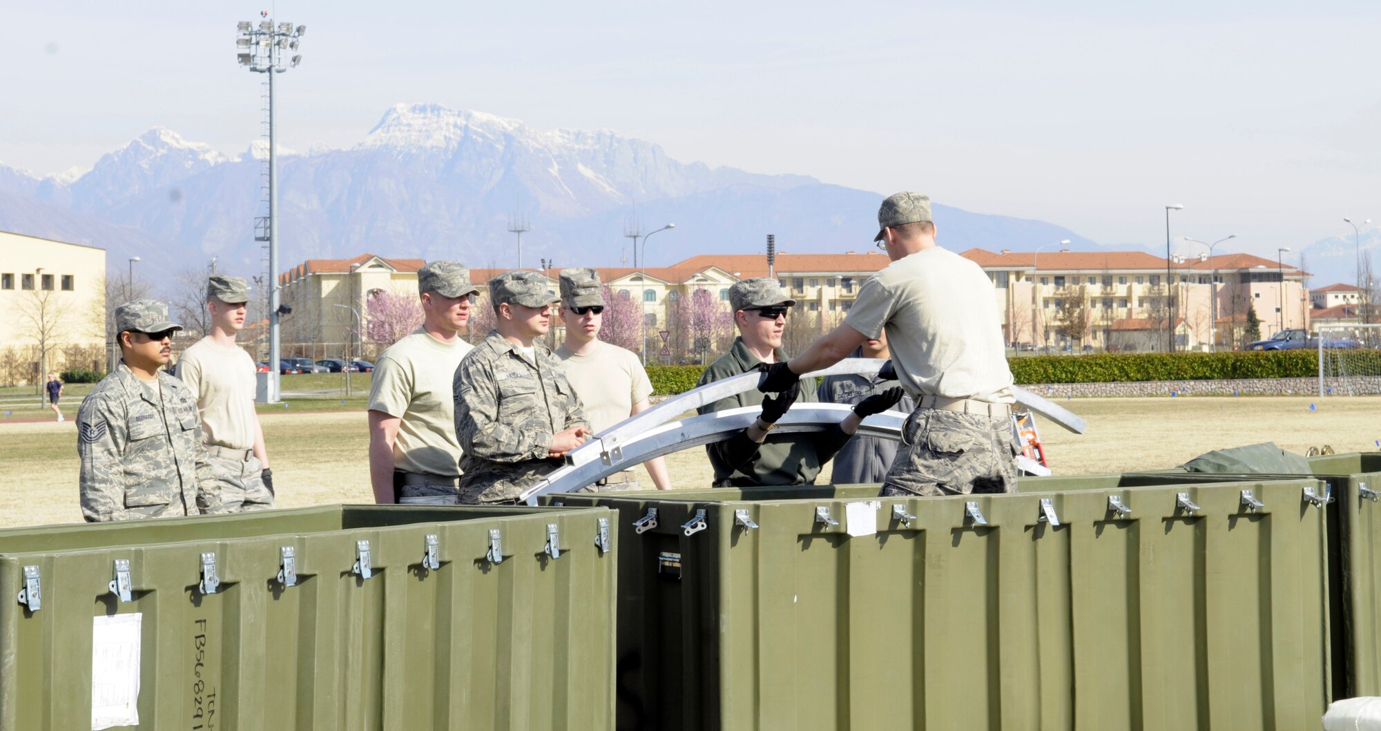 Airmen from various U.S. Air Forces in Europe civil engineer squadrons join forces to set up Alaskan small shelter tents at Aviano Air Base, Italy, March 22, 2011, in support of Operation Odyssey Dawn. Joint Task Force Odyssey Dawn is the U.S. Africa Command task force established to support the larger international response to the unrest in Libya.  A broad coalition of nations are partnering to enforce U.N. Security Council Resolution (UNSCR) 1973, which authorizes all necessary means to protect civilians in Libya under threat of attack by Qadhafi regime forces.  JTF Odyssey Dawn is commanded by Admiral Samuel J. Locklear, III. (U.S. Air Force photo/ Airman Briana Jones)