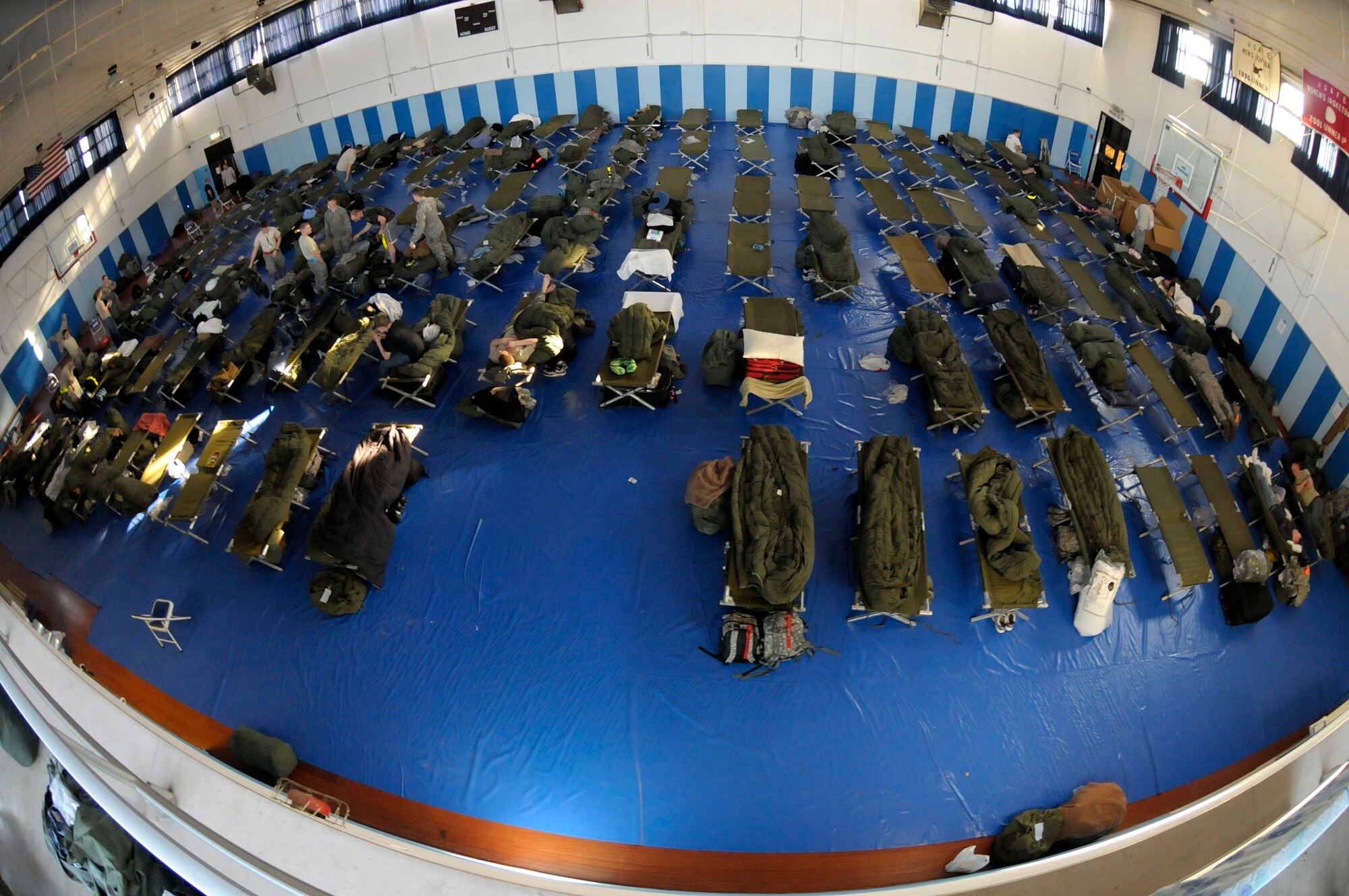 Servicemembers deployed to Aviano Air Base, Italy, in support of Joint Task Force Odyssey Dawn temporarily reside in the Falcon Fitness Center March 22, 2011. Joint Task Force Odyssey Dawn is the U.S. Africa Command Task force established to support the larger international response to the unrest in Libya. A broad coalition of nations are partnering to enforce U.N. Security Council Resolution (UNSCR) 1973, which authorizes all necessary means to protect civilians in Libya under threat of attack by Qadhafi regime forces.  JTF Odyssey Dawn is commanded by Admiral Samuel J. Locklear, III.  (US Army Photo by SSG Tierney P. Wilson)