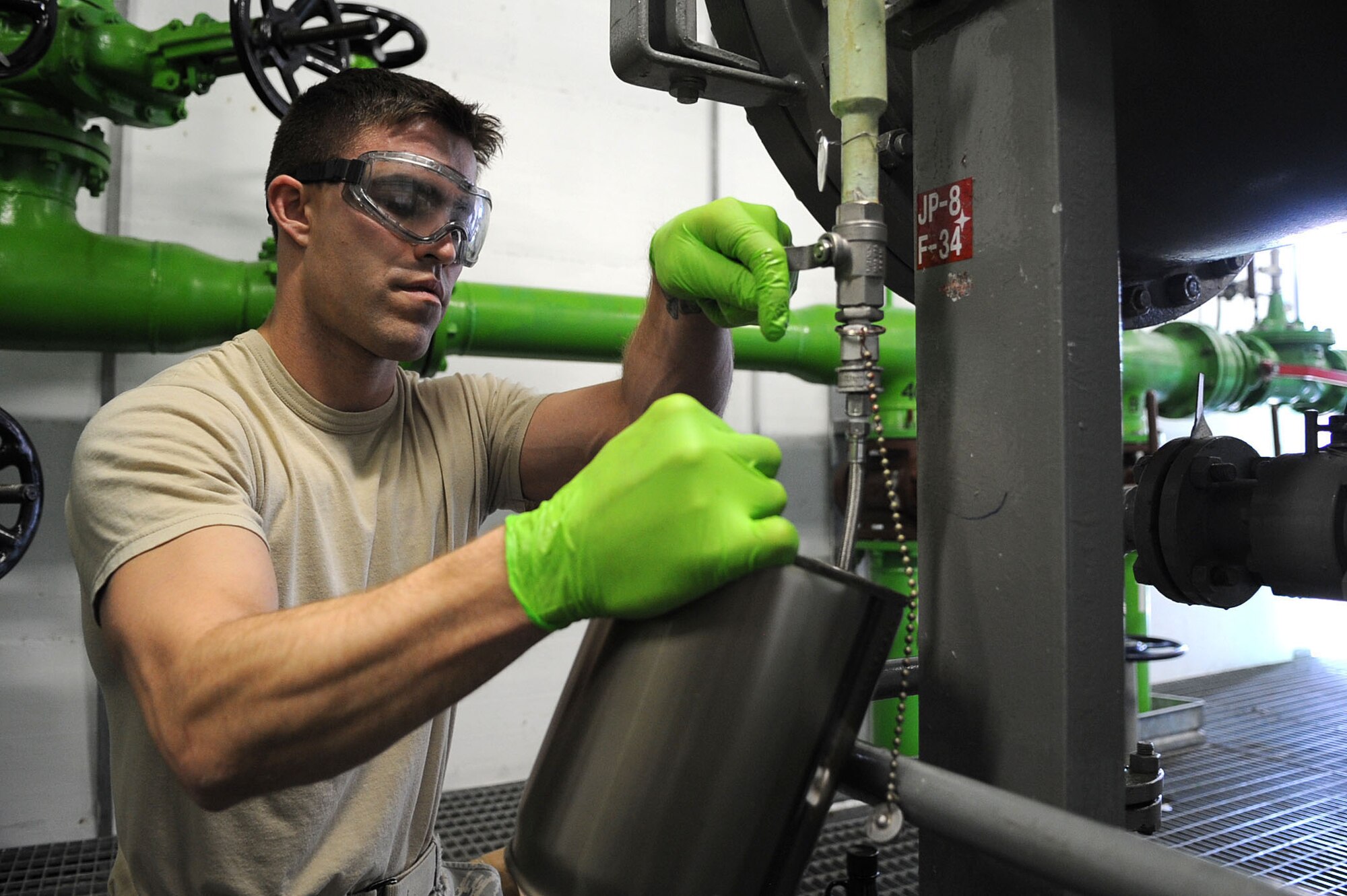 Senior Airman Lawson McLester, a fuel lab technician with the 31st Logistics Readiness Squadron at Aviano Air Base, Italy, takes fuel samples for routine testing during Joint Task Force Odyssey Dawn March 22, 2011. Joint Task Force Odyssey Dawn is the U.S. Africa Command Task force established to support the larger international response to the unrest in Libya. A broad coalition of nations are partnering to enforce U.N. Security Council Resolution (UNSCR) 1973, which authorizes all necessary means to protect civilians in Libya under threat of attack by Qadhafi regime forces.  JTF Odyssey Dawn is commanded by Admiral Samuel J. Locklear, III.  (US Army Photo by SSG Tierney P. Wilson)