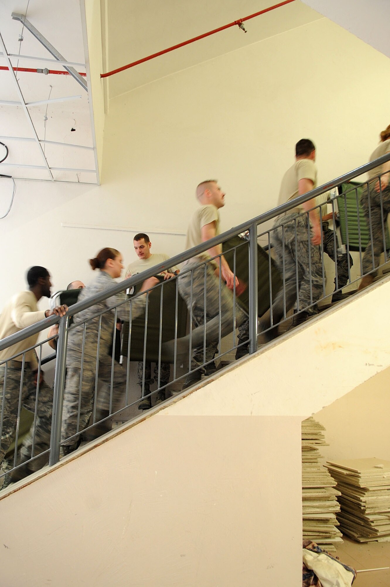 Airmen at Aviano Air Force Base, Italy, set up cots for incoming servicemembers deployed in support of Joint Task Force Odyssey Dawn on March 21, 2011. Joint Task Force Odyssey Dawn is the U.S. Africa Command Task force established to support the larger international response to the unrest in Libya. A broad coalition of nations are partnering to enforce U.N. Security Council Resolution (UNSCR) 1973, which authorizes all necessary means to protect civilians in Libya under threat of attack by Qadhafi regime forces.  JTF Odyssey Dawn is commanded by Admiral Samuel J. Locklear, III.  (US Army Photo by SSG Tierney P. Wilson)