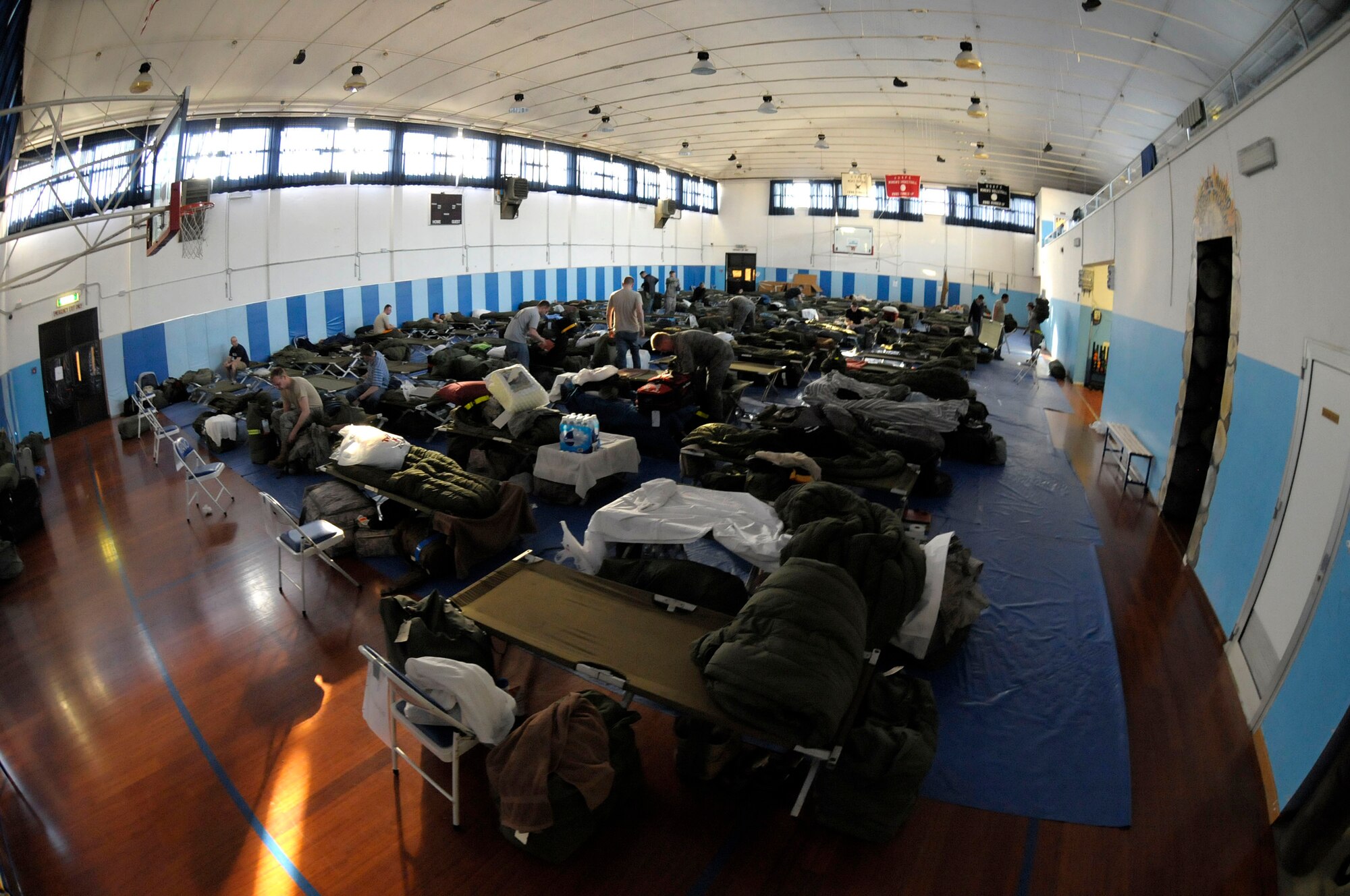 Servicemembers deployed to Aviano Air Base, Italy, in support of Joint Task Force Odyssey Dawn temporarily reside in the Falcon Fitness Center on March 22, 2011. Joint Task Force Odyssey Dawn is the U.S. Africa Command Task force established to support the larger international response to the unrest in Libya. A broad coalition of nations are partnering to enforce U.N. Security Council Resolution (UNSCR) 1973, which authorizes all necessary means to protect civilians in Libya under threat of attack by Qadhafi regime forces.  JTF Odyssey Dawn is commanded by Admiral Samuel J. Locklear, III.  (US Army Photo by SSG Tierney P. Wilson)