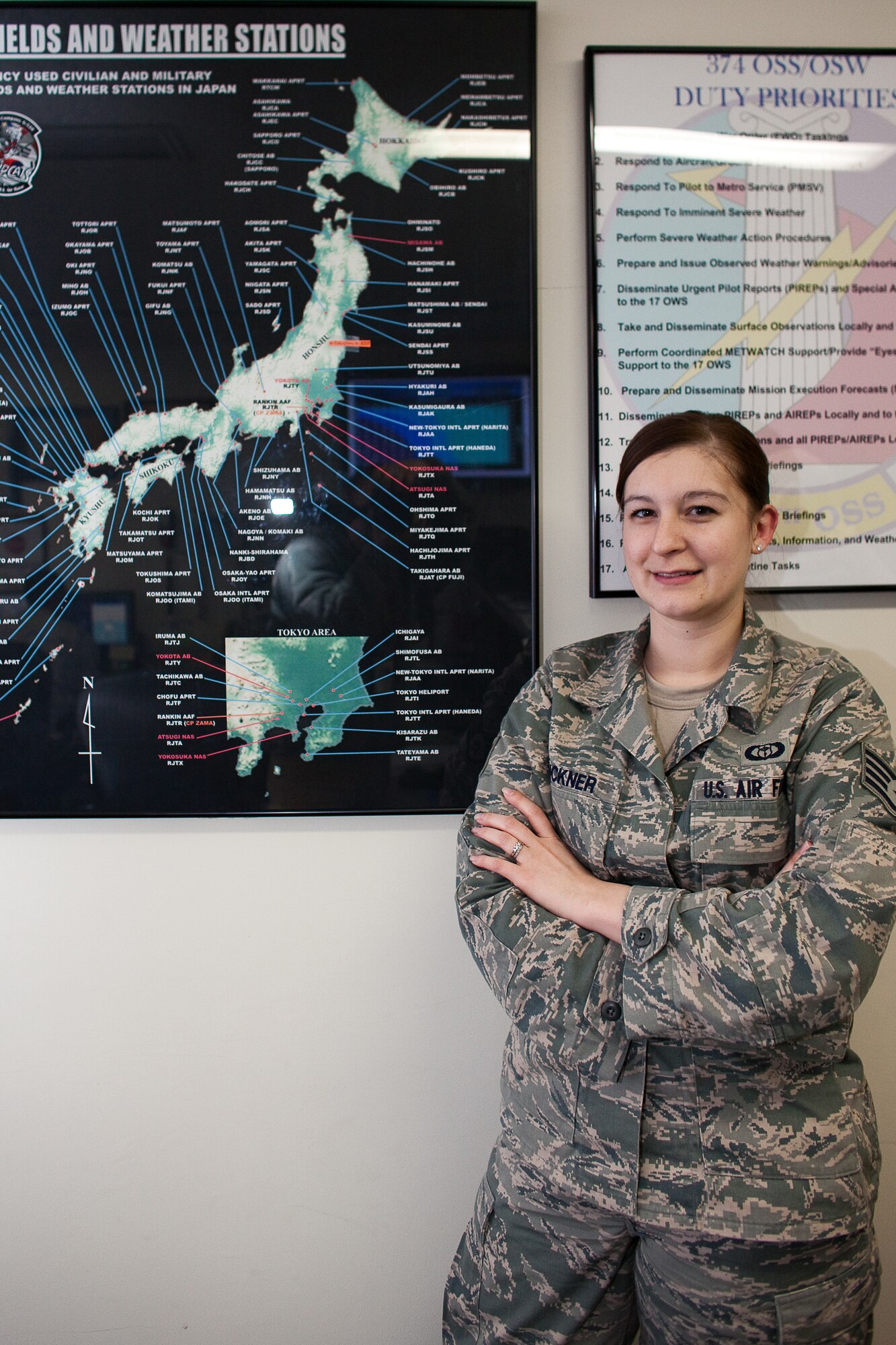 YOKOTA AIR BASE, Japan -- Staff Sgt. Eryn Buckner, 374th Operations Support Squadron, works as an Aviation Weather Forecaster at Yokota Air Base, Japan. A native of Kerrville, Texas, Sergeant Buckner briefs aircrew members on weather conditions prior to operations. The number of flights here has increased dramatically since the start of Operation Tomodachi, March 11. (U.S. Air Force photo/Osakabe Yasuo)