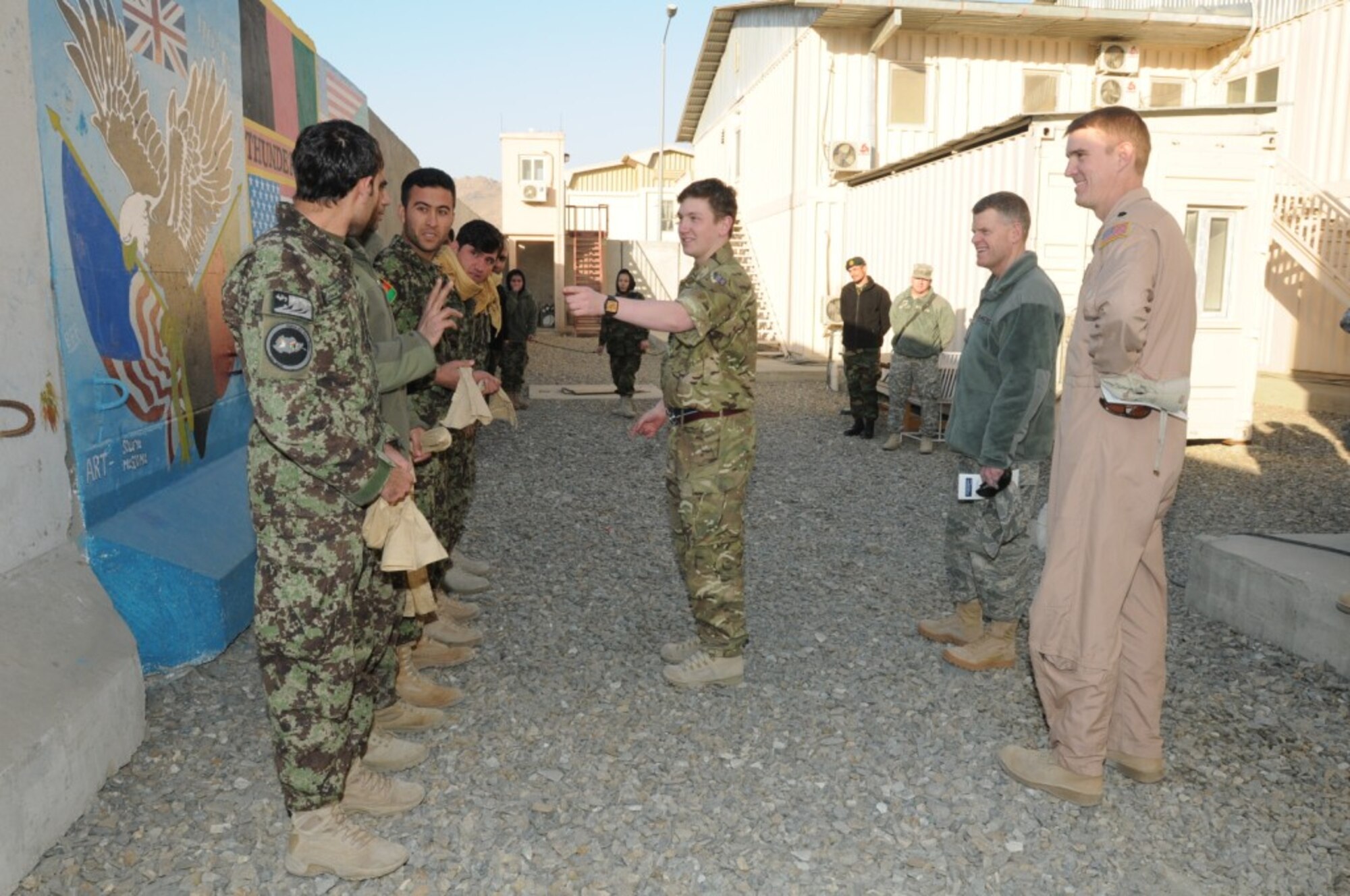 Royal Air Force Flt. Lt. Dean Curt, 438th Air Expeditionary Wing Operations, instructs Afghan Air Force Airmen studying at the “Thunder Lab” English immersion program at the AAF Base in Kabul during an English language and team building exercise Jan. 15. (U.S. Air Force courtesy photo)