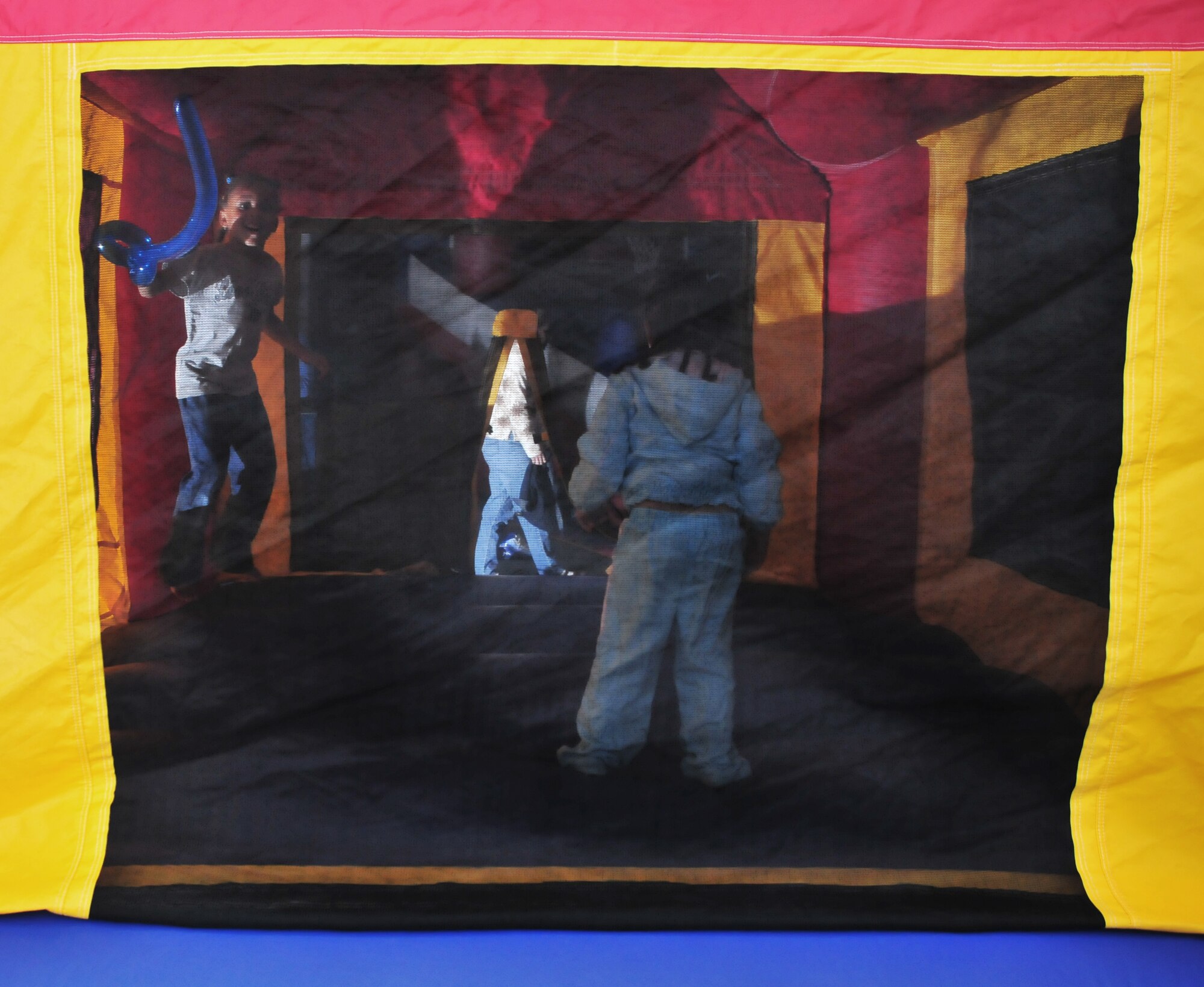 Children play in the bouncy castle during the “Kids Karnival” at the Incirlik Community Center March 16, 2011, at Incirlik Air Base, Turkey. During the carnival, families spent time together playing games, eating and participating in other activities. This event was held to boost the morale of Airmen and their families here at Incirlik, officials said. (U.S. Air Force photo by Staff Sgt. Alexandre Montes/Released)