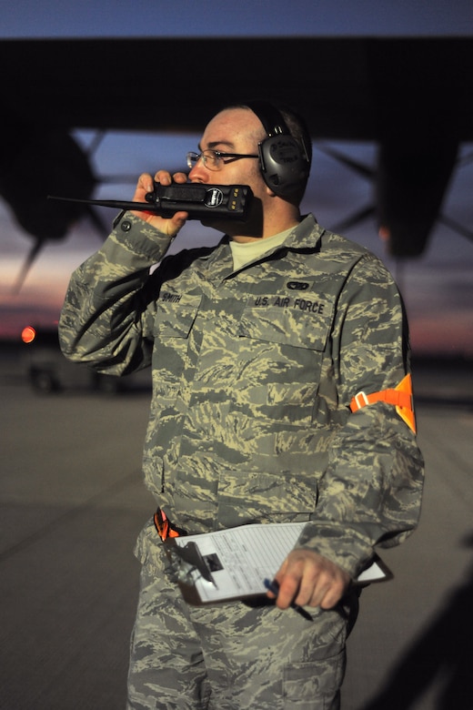 SPANGDAHLEM AIR BASE, Germany – An Airman assigned to the 726th Air Mobility Squadron relays information about an outgoing C-130J Super Hercules here in support of Operation Odyssey Dawn March 21. Joint Task Force Odyssey Dawn is the U.S. Africa Command task force established to provide operational and tactical command and control of U.S. military forces supporting the international response to the unrest in Libya and enforcement of United Nations Security Council Resolution (UNSCR) 1973. UNSCR 1973 authorizes all necessary measures to protect civilians in Libya under threat of attack by Qadhafi regime forces.  JTF Odyssey Dawn is commanded by U.S. Navy Admiral Samuel J. Locklear, III. (U.S. Air Force photo/Senior Airman Nathanael Callon)