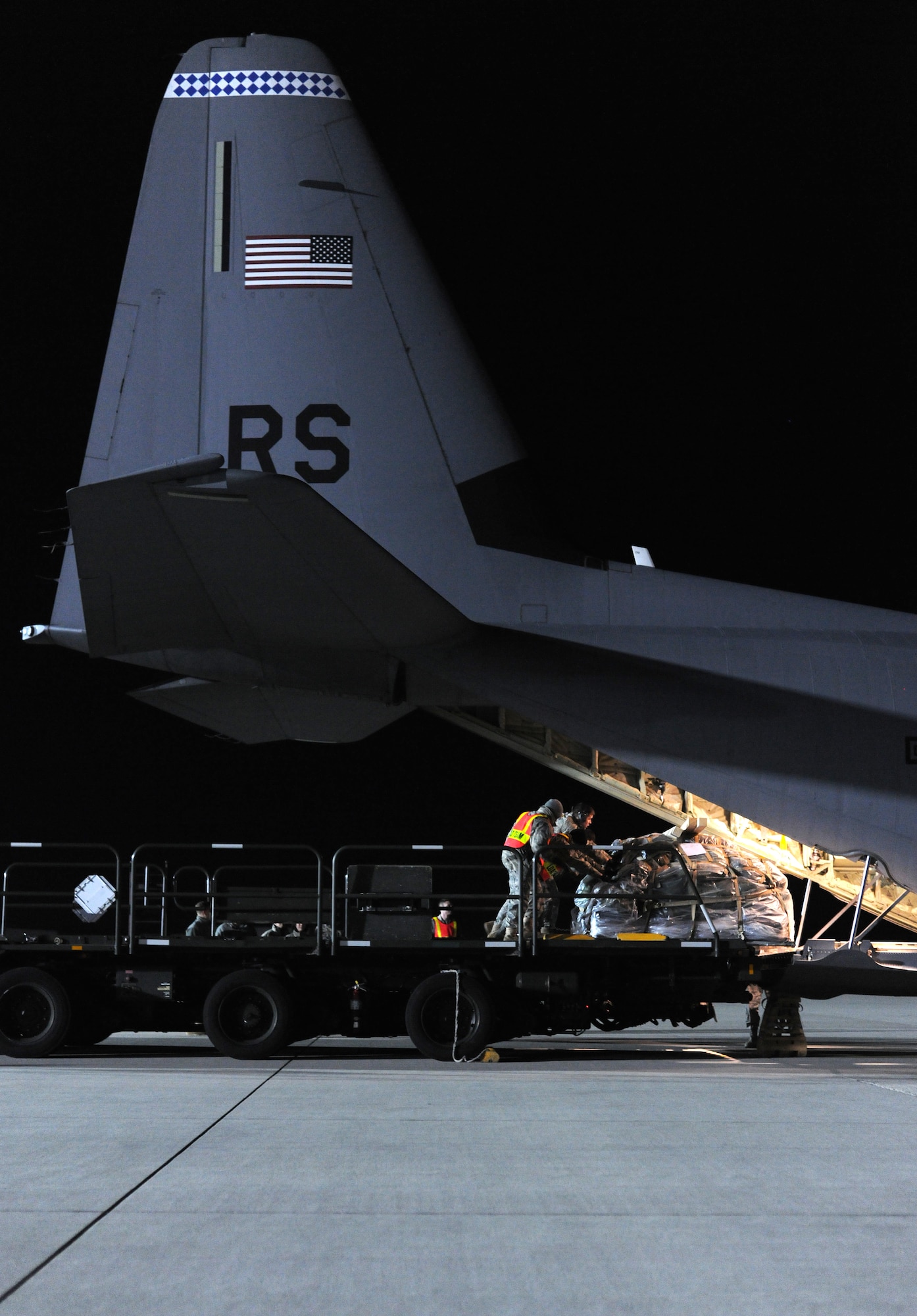 SPANGDAHLEM AIR BASE, Germany – Airmen load pallets of cargo into a C-130J Super Hercules here in support of Operation Odyssey Dawn March 20. Joint Task Force Odyssey Dawn is the U.S. Africa Command task force established to provide operational and tactical command and control of U.S. military forces supporting the international response to the unrest in Libya and enforcement of United Nations Security Council Resolution (UNSCR) 1973. UNSCR 1973 authorizes all necessary measures to protect civilians in Libya under threat of attack by Qadhafi regime forces.  JTF Odyssey Dawn is commanded by U.S. Navy Admiral Samuel J. Locklear, III. (U.S. Air Force photo/Senior Airman Nathanael Callon)