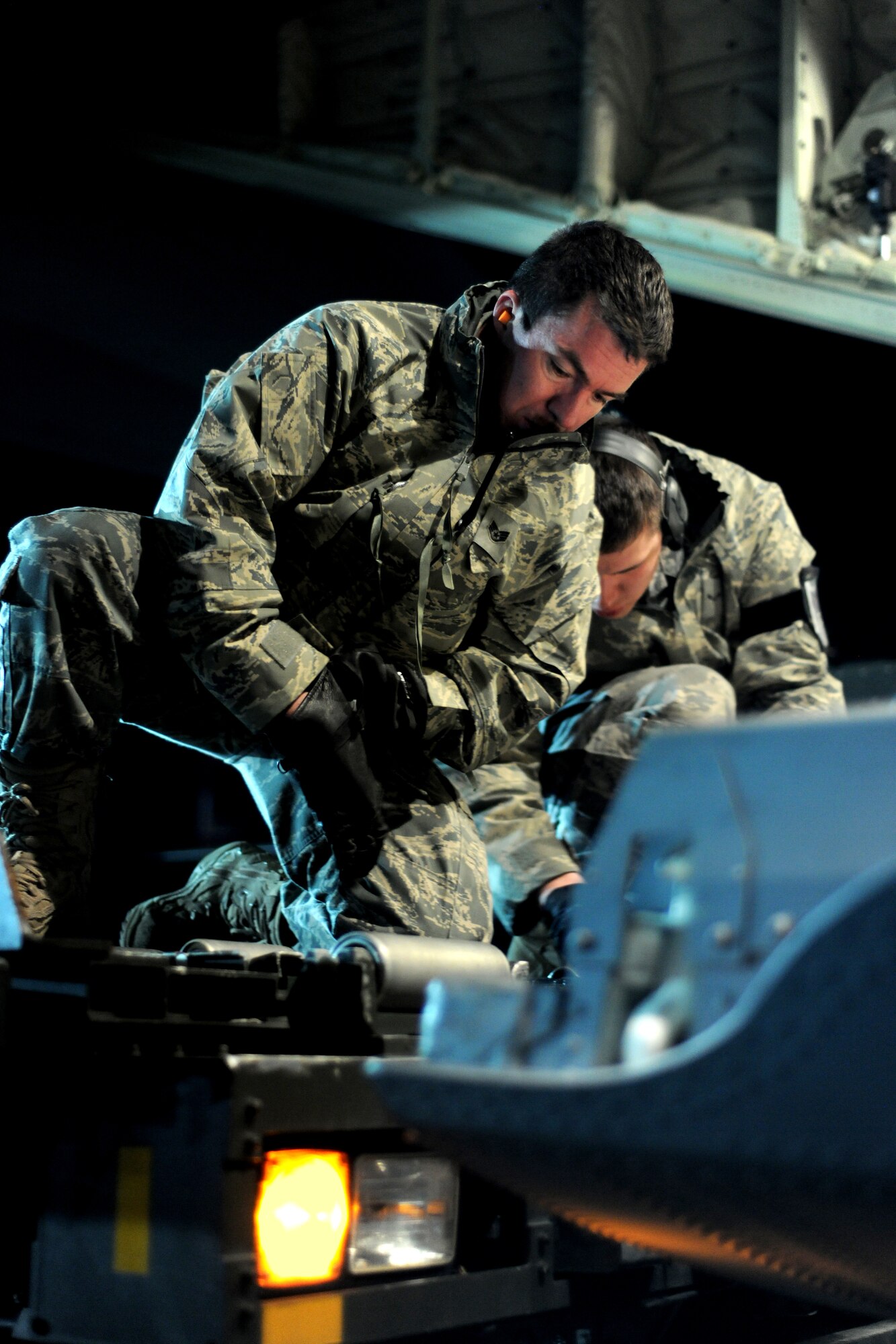 SPANGDAHLEM AIR BASE, Germany – Airmen from the 726th Air Mobility Squadron prepare to load cargo onto a C-130J Super Hercules here in support of Operation Odyssey Dawn March 20.  Joint Task Force Odyssey Dawn is the U.S. Africa Command task force established to provide operational and tactical command and control of U.S. military forces supporting the international response to the unrest in Libya and enforcement of United Nations Security Council Resolution (UNSCR) 1973. UNSCR 1973 authorizes all necessary measures to protect civilians in Libya under threat of attack by Qadhafi regime forces.  JTF Odyssey Dawn is commanded by U.S. Navy Admiral Samuel J. Locklear, III. (U.S. Air Force photo/Senior Airman Nathanael Callon)