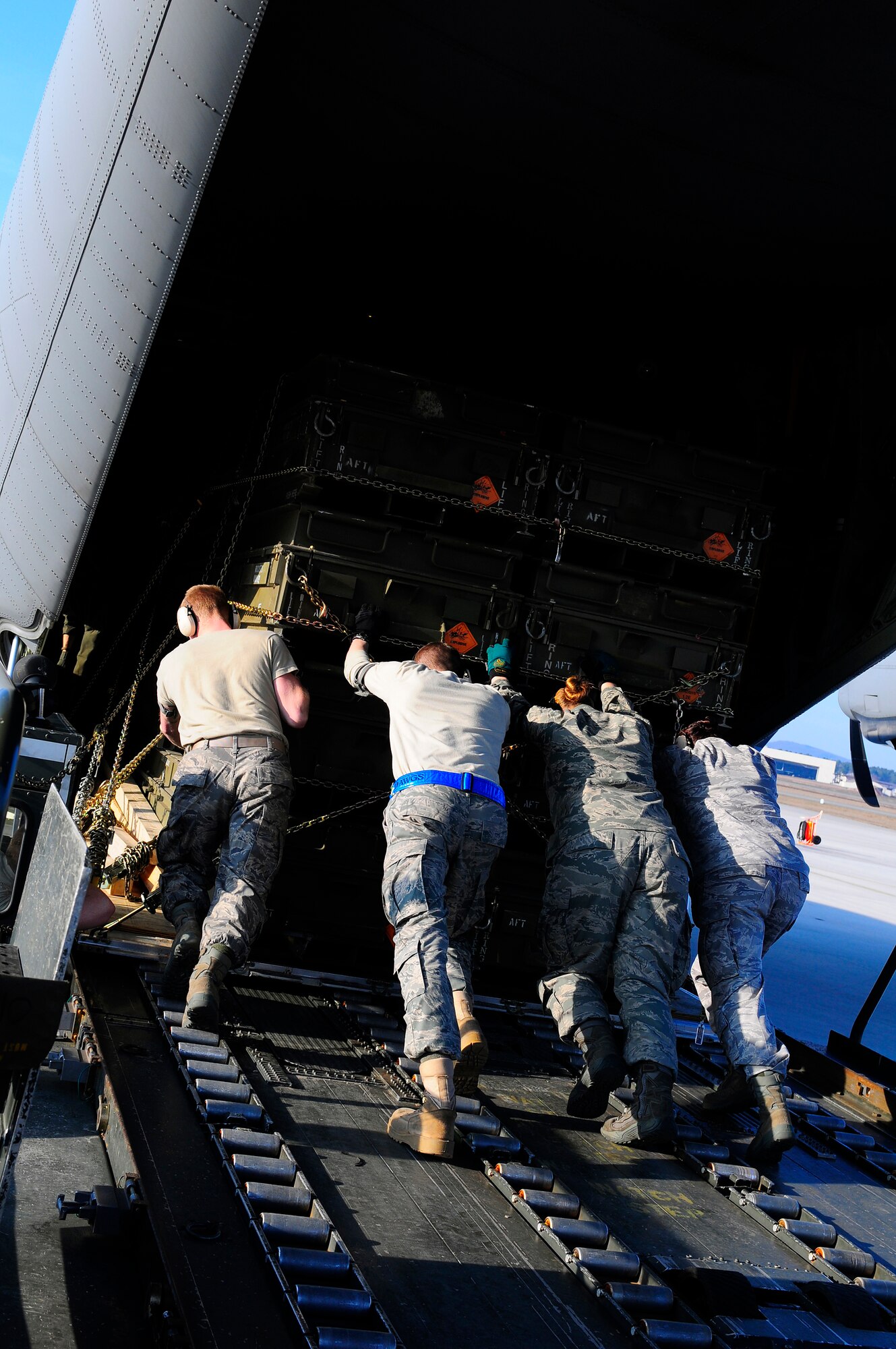 U.S. Air Force Airmen from the 721st Aerial Port Squadron load cargo onto a C-130J Super Hercules for its departure in support of Joint Task Force Odyssey Dawn, Ramstein Air Base, Germany, March 23, 2011. Joint Task Force Odyssey Dawn is the U.S. Africa Command task force established to provide operational and tactical command and control of U.S. military forces supporting the international response to the unrest in Libya and enforcement of United Nations Security Council Resolution 1973. UNSCR 1973 authorizes all necessary measures to protect civilians in Libya under threat of attack by Qadhafi regime forces. JTF Odyssey Dawn is commanded by U.S. Navy Admiral Samuel J. Locklear, III.
(U.S. Air Force Photo by Airman 1st Class Brea Miller)(released)