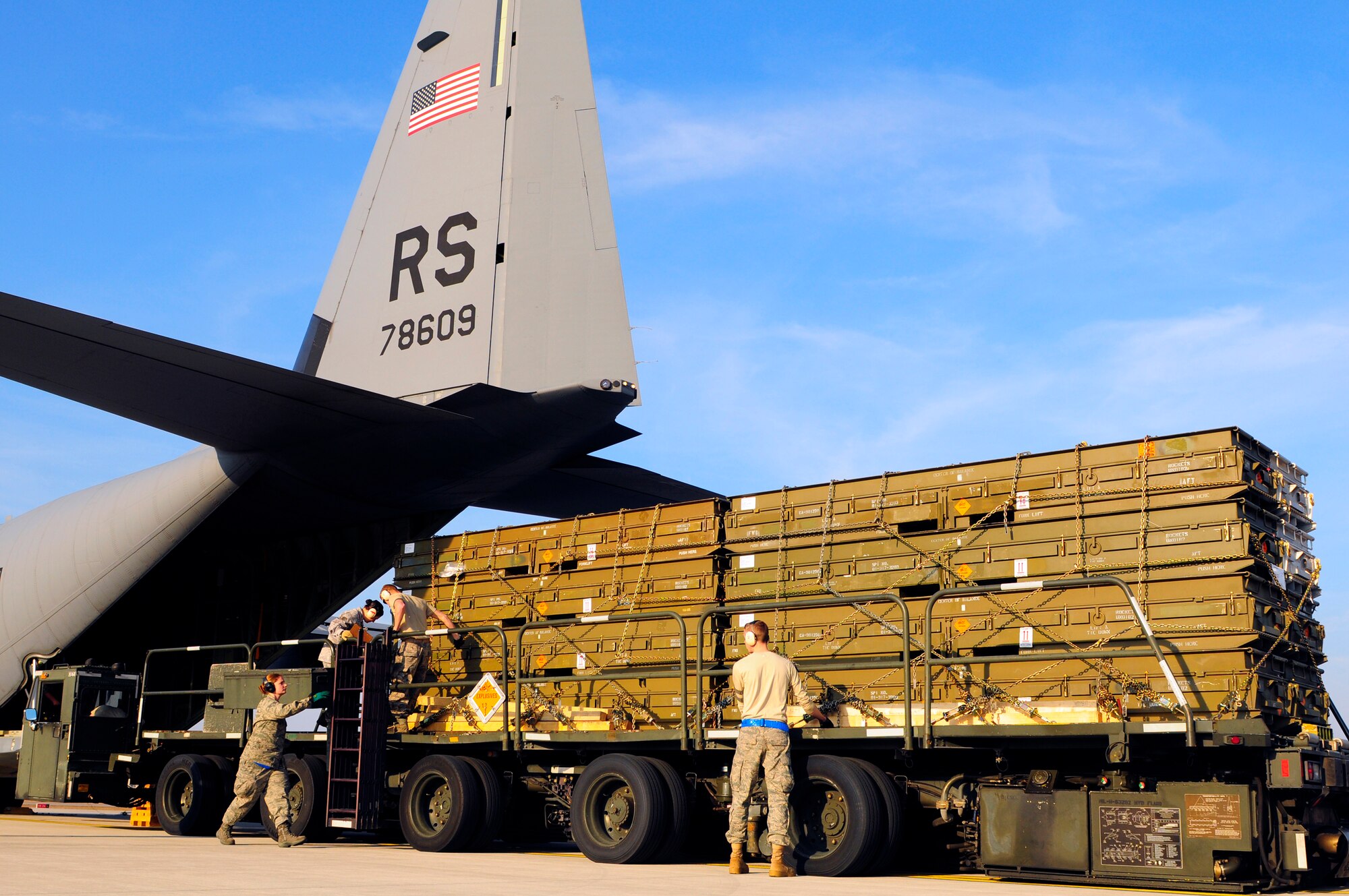 U.S. Air Force Airmen from the 721st Aerial Port Squadron prepare to load cargo onto a C-130J Super Hercules for its departure in support of Joint Task Force Odyssey Dawn, Ramstein Air Base, Germany, March 23, 2011. Joint Task Force Odyssey Dawn is the U.S. Africa Command task force established to provide operational and tactical command and control of U.S. military forces supporting the international response to the unrest in Libya and enforcement of United Nations Security Council Resolution 1973. UNSCR 1973 authorizes all necessary measures to protect civilians in Libya under threat of attack by Qadhafi regime forces. JTF Odyssey Dawn is commanded by U.S. Navy Admiral Samuel J. Locklear, III.
(U.S. Air Force Photo by Airman 1st Class Brea Miller)