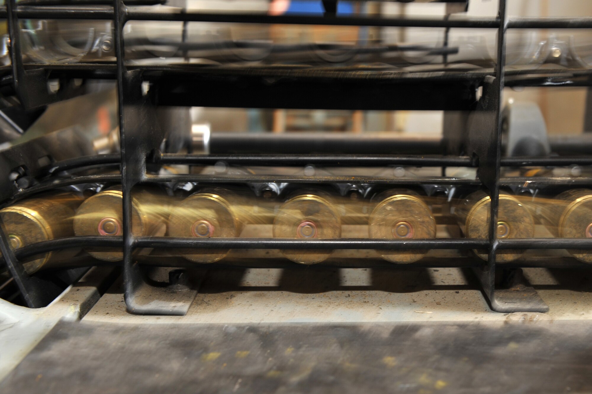 Twenty millimeter rounds go through the linkless ammunition loading system at Bagram Airfield, Afghanistan, March 23, 2011. The loading system helps members from the 455th Expeditionary Maintenance Squadron Ammunition Supply Point conduct inventories and inspections. (U.S. Air Force photo by Senior Airman Sheila deVera)