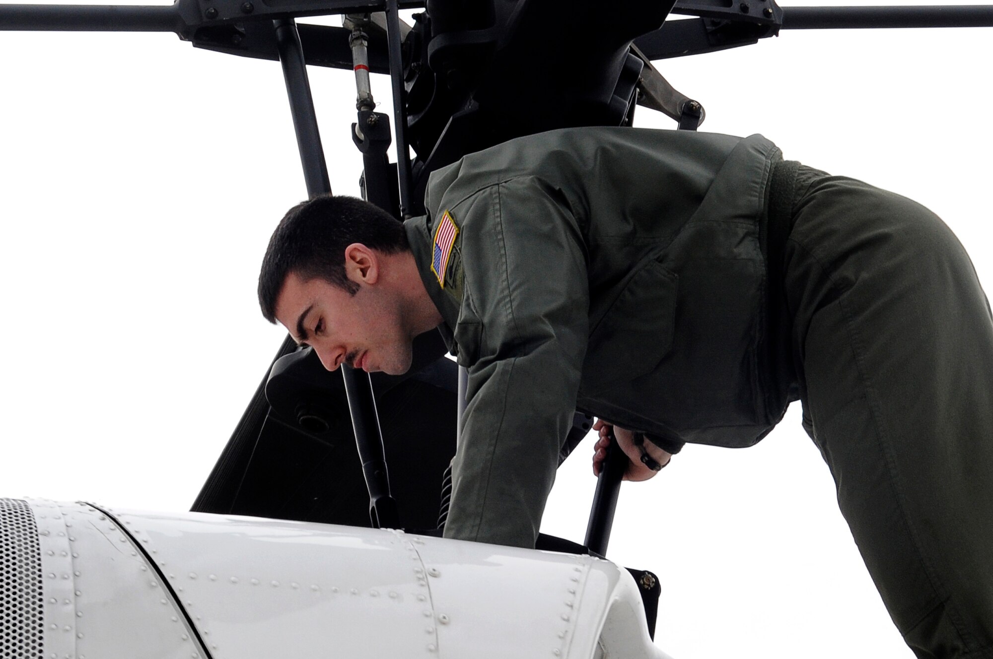 YOKOTA AIR BASE, Japan -- Senior Airman Andy Schloemer, 459th Airlift Squadron, prepares a UH-1 Huey helicopter for flight on Yokota Air Base, March 23, 2011. The helicopters are critical in providing logistical support by transporting general officers, Department of Energy personnel and other officials in support of Operation Tomodachi. (U.S. Air Force photo/Master Sgt. Jeromy K. Cross/released)







