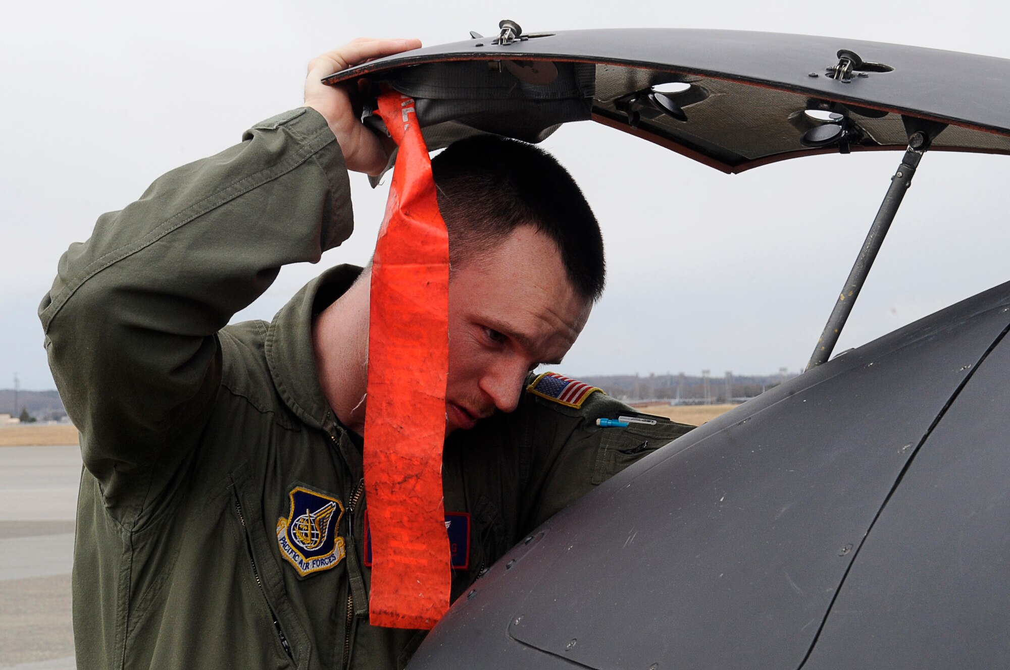 YOKOTA AIR BASE, Japan -- 1st Lt Sean Abling, 459th Airlift Squadron, preforms a preflight check on a UH-1 Huey helicopter on Yokota, March 23, 2011. The helicopters are critical in providing logistical support by transporting general officers, Department of Energy personnel and other officials in support of Operation Tomodachi. (U.S. Air Force photo/Master Sgt. Jeromy K. Cross/released)








