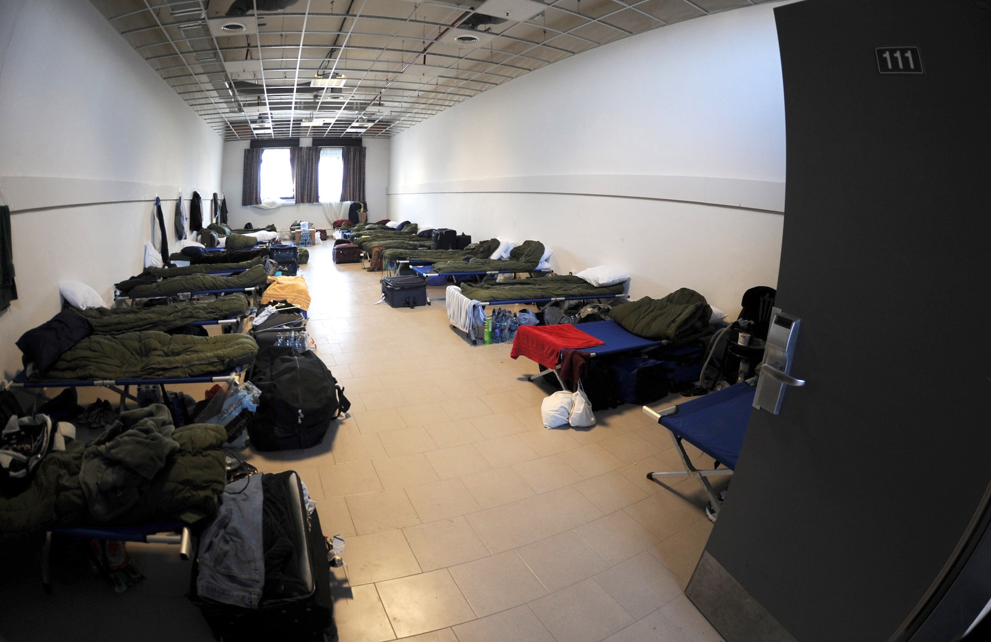 A temporary lodging room houses personnel arriving at Aviano Air Base, Italy, in support of Operation Odyssey Dawn March 20. Joint Task Force Odyssey Dawn is the U.S. Africa Command task force established to support the larger international response to the unrest in Libya. A broad coalition of nations are partnering to enforce U.N. Security Council Resolution (UNSCR) 1973, which authorizes all necessary means to protect civilians in Libya under threat of attack by Qadhafi regime forces.  JTF Odyssey Dawn is commanded by Admiral Samuel J. Locklear, III. (U.S. Air Force photo/Staff Sgt. Nadine Y. Barclay)