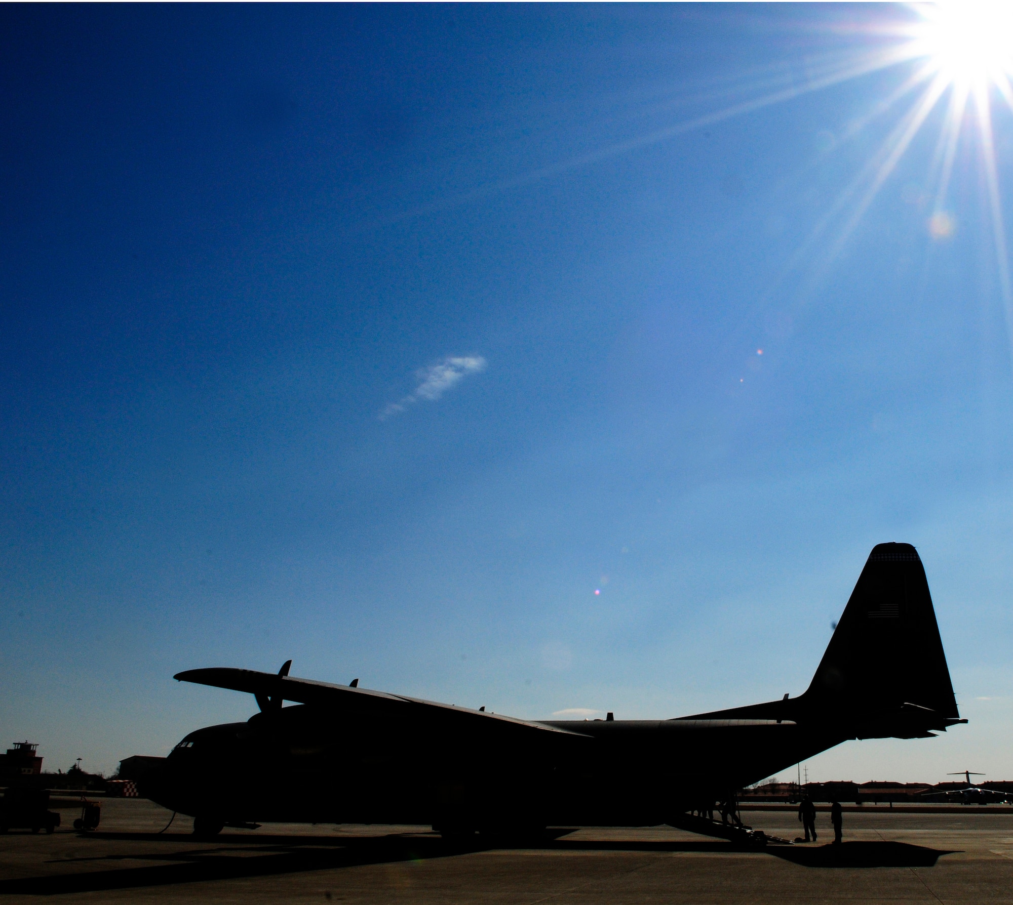 A U.S. Air Force C-130 Hercules sits on the runway after arriving at Aviano Air Base, Italy, from Ramstein Air Base, Germany, March 21, 2011. The aircraft arrived carrying equipment and personnel to support Operation Odyssey Dawn. Joint Task Force Odyssey Dawn is the U.S. Africa Command task force established to support the larger international response to the unrest in Libya.  A broad coalition of nations are partnering to enforce U.N. Security Council Resolution (UNSCR) 1973, which authorizes all necessary means to protect civilians in Libya under threat of attack by Qadhafi regime forces.  JTF Odyssey Dawn is commanded by Admiral Samuel J. Locklear, III. (U.S. Air Force photo by Airman 1st Class Katherine Windish)