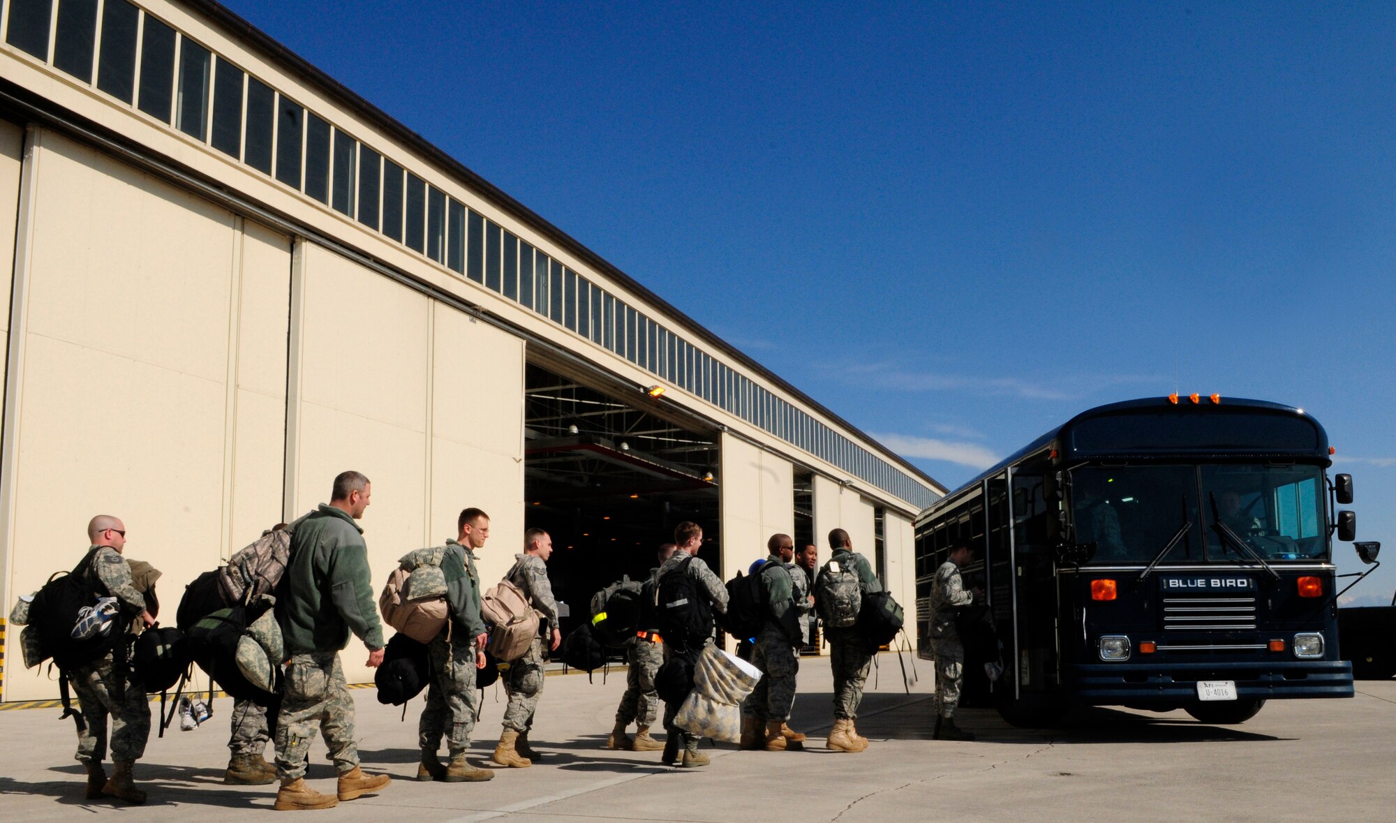 Airmen arriving to Aviano Air Base, Italy from Spangdahlem Air Base, Germany and Royal Air Force Lakenheath, U.K. March 21, 2011 get onto a bus to be transported to lodging. The Airmen are on temporary duty to Aviano in support of Operation Odyssey Dawn. Joint Task Force Odyssey Dawn is the U.S. Africa Command task force established to support the larger international response to the unrest in Libya.  A broad coalition of nations are partnering to enforce U.N. Security Council Resolution (UNSCR) 1973, which authorizes all necessary means to protect civilians in Libya under threat of attack by Qadhafi regime forces.  JTF Odyssey Dawn is commanded by Admiral Samuel J. Locklear, III. (U.S. Air Force photo by Airman 1st Class Katherine Windish)