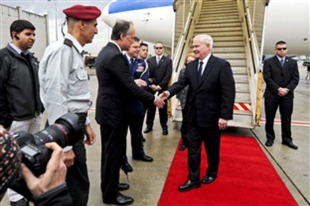 U.S. Ambassador to Israel James B. Cunningham greets U.S. Defense Secretary Robert M. Gates and his wife, Becky, upon their arrival in Tel Aviv, Israel, March 24, 2011.