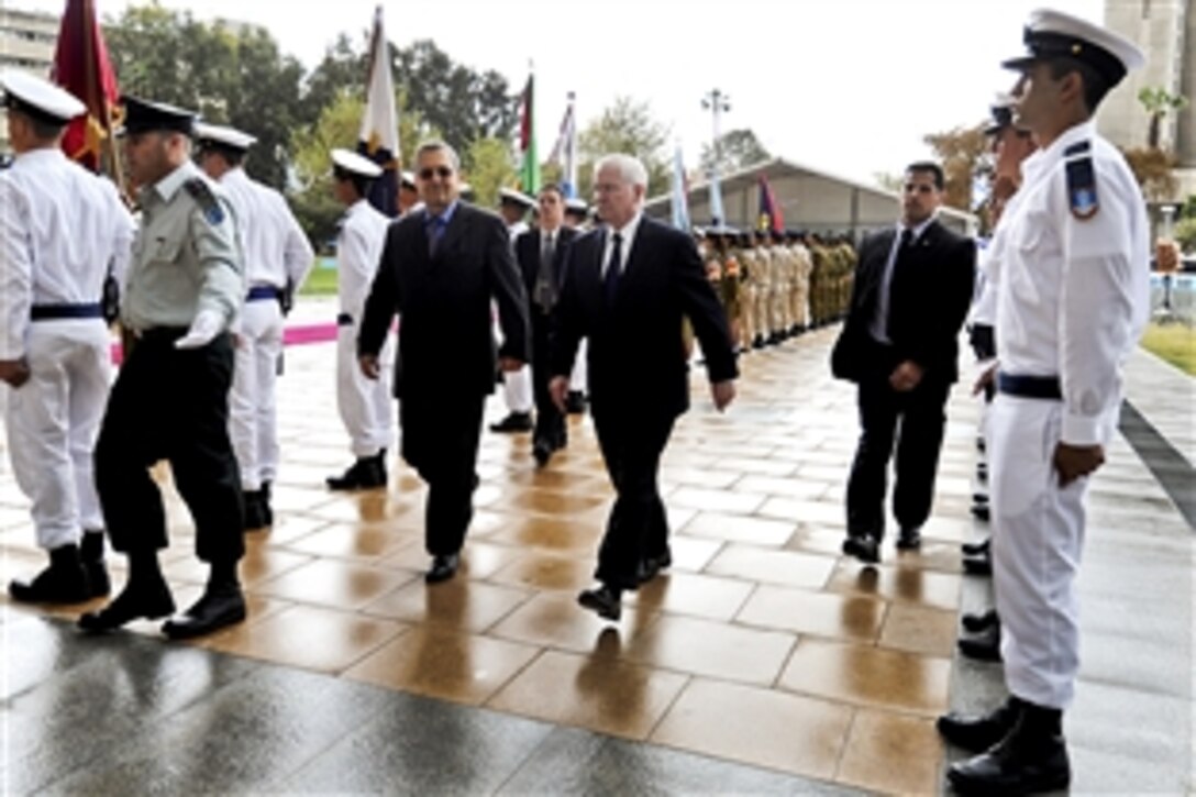 U.S. Defense Secretary Robert M. Gates and Israeli Defense Minister Ehud Barak review the troops during an honor arrival ceremony in Tel Aviv, Israel, March 24, 2011.