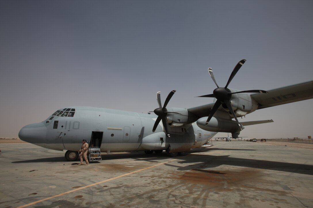 Cpl. Jessica M. Egan, a crew chief with Marine Aerial Refueler Transport Squadron 352, performs a preflight inspection on the Harvest Hawk equipped KC-130J at Camp Dwyer, Afghanistan, March 25. The one-of-a-kind Harvest Hawk system includes a version of the target sight sensor used on the AH-1Z Cobra attack helicopter as well as a complement  of four AGM-114 Hellfire and 10 Griffin missiles.