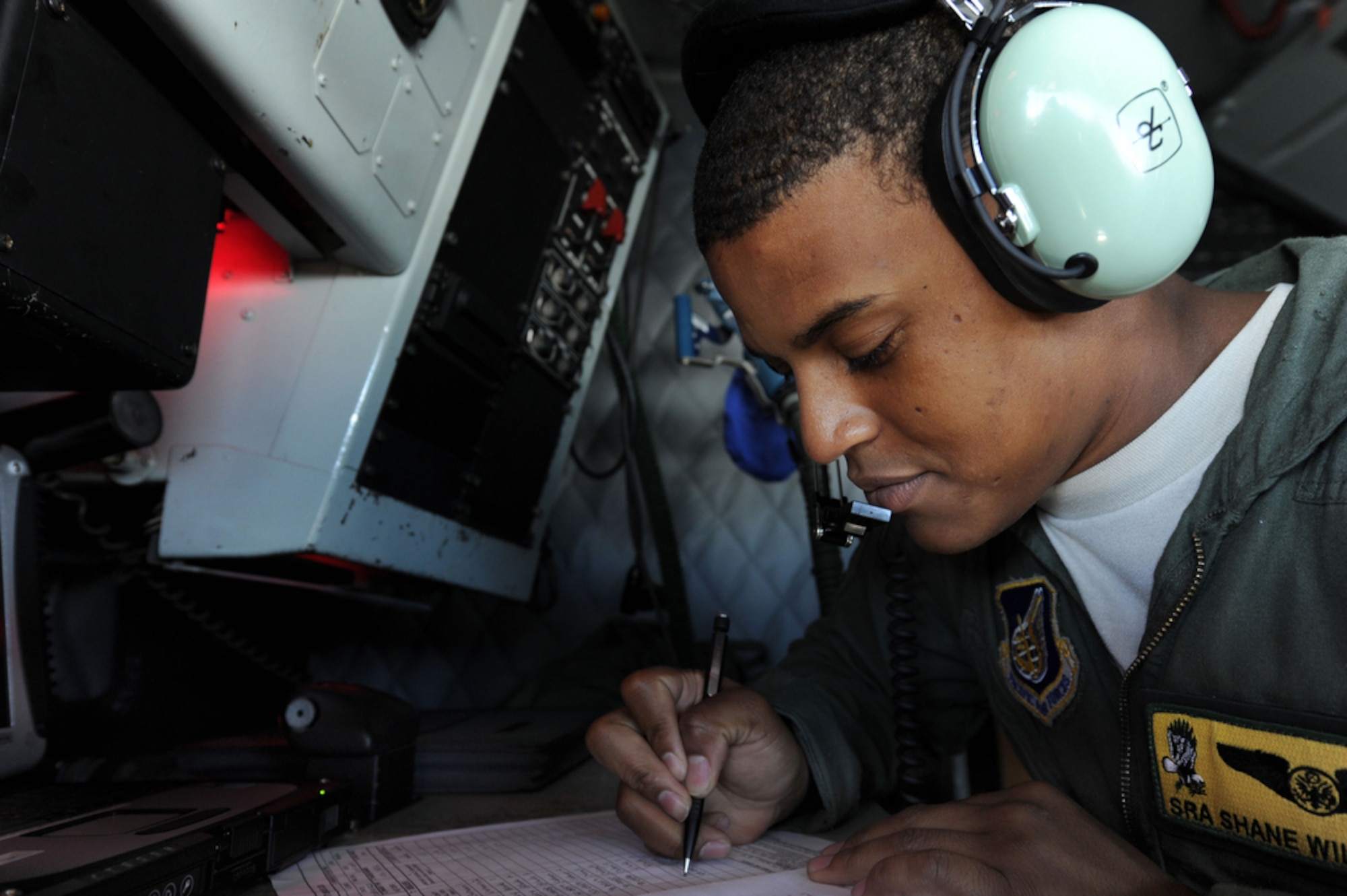 Lancaster, Calif. native, Senior Airman Shane Williams, a boom operator assigned to the 96th Air Refueling Squadron, Joint Base Pearl Harbor-Hickam, Hawaii calculates the amount of fuel off-loaded to four U.S. f-15's and three Thai f-16's on March 21 over Thailand during Cope Tiger 2011,  an annual, multilateral, joint field training exercise currently being conducted at Korat and Udon Thani Royal Thai Air Bases March 14 through 25. Participants of Cope Tiger include the U.S. Air Force, the U.S. Marine Corps, the Royal Thai Air Force, Royal Thai Army, and the Republic of Singapore Air Force. (U.S.  Air Force photo/Master Sgt. Cohen A. Young)
