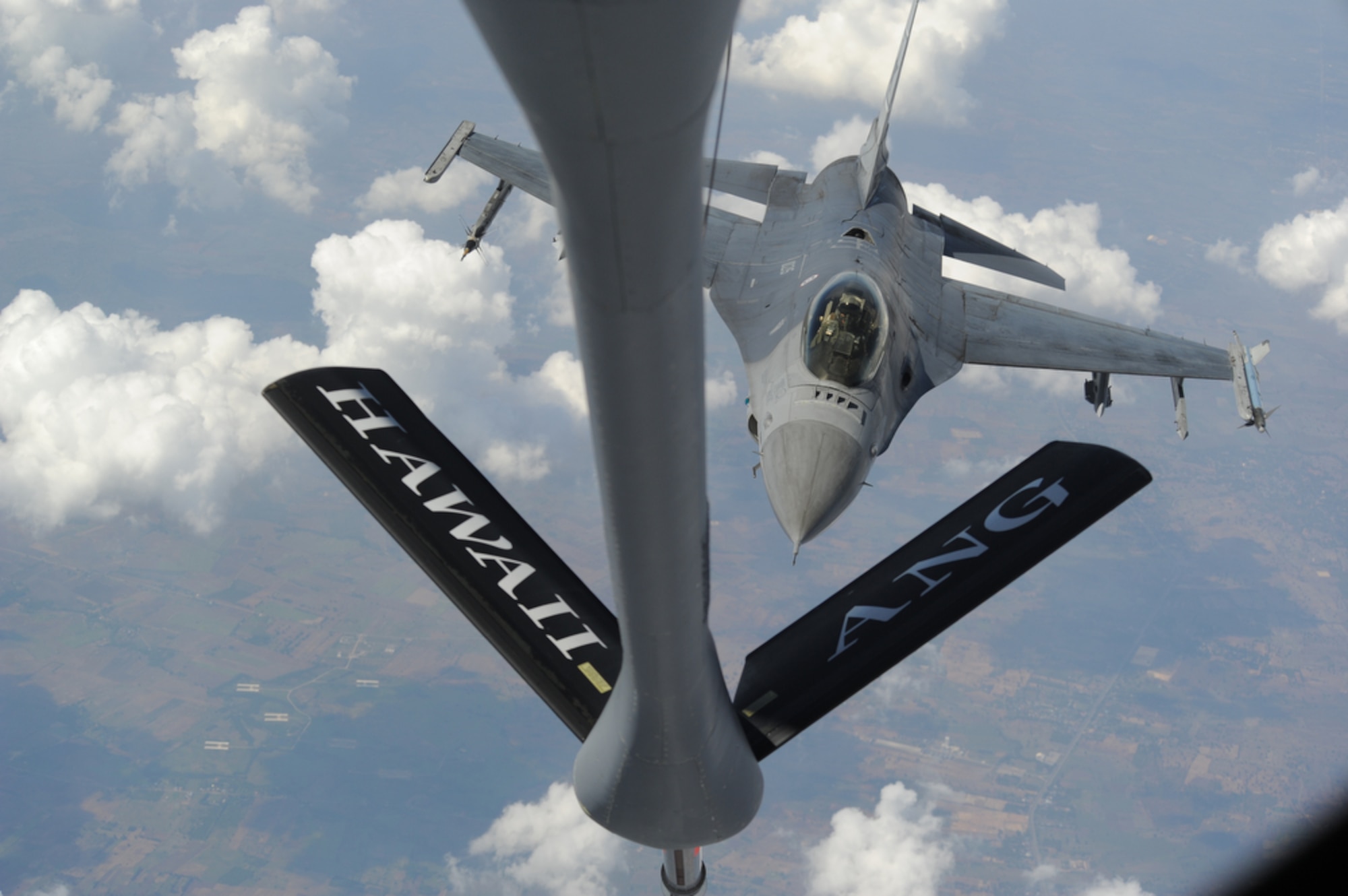 An f-16 from the Royal Thai Air Force is refueled by a KC-135 from the 203rd Air Refueling Squadron, Joint Base Pearl Harbor-Hickam, Hawaii on March 21 over Thailand air space before continuing maneuvers during Cope Tiger 2011,  an annual, multilateral, joint field training exercise currently being conducted at Korat and Udon Thani Royal Thai Air Bases March 14 through 25. Participants of Cope Tiger include the U.S. Air Force, the U.S. Marine Corps, the Royal Thai Air Force, Royal Thai Army, and the Republic of Singapore Air Force. (U.S.  Air Force photo/Master Sgt. Cohen A. Young)