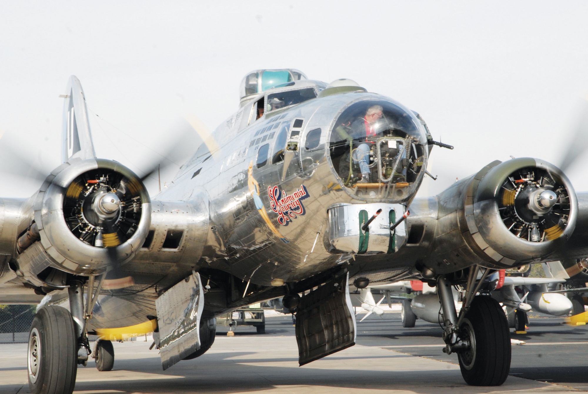 As the members took their seats on the B-17 March 18, the pilots tested the four engines before takeoff to Luke Air Force Base. This B-17 model needed four turbo-charged single-row nine-cylinder air cooled radial engines to carry an extra load of 8,000 pounds.  (U.S. Air Force photo/Airman 1st Class David Owsianka)
