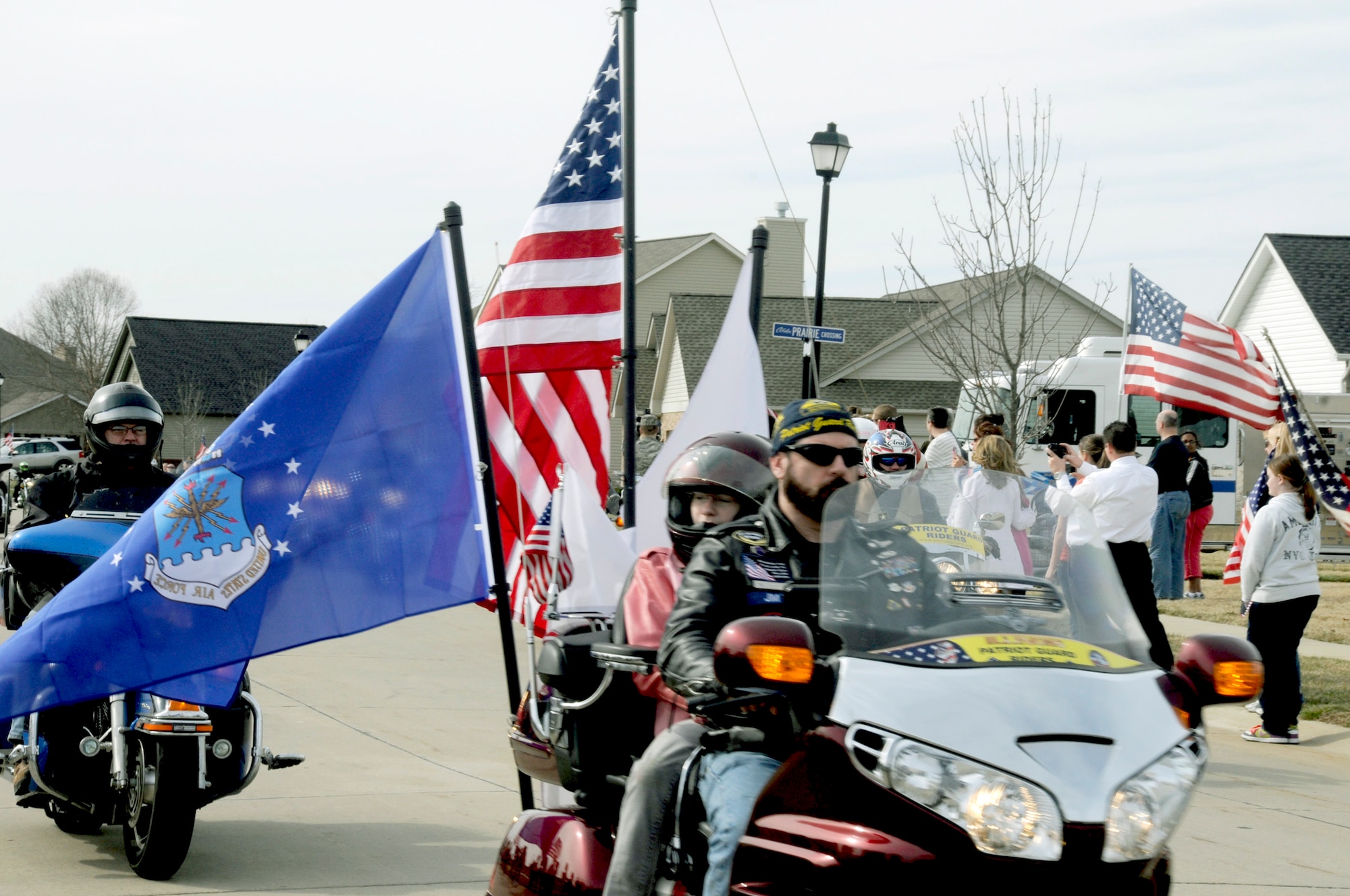 Patriot Guard Riders lead the funeral procession route of Airman 1st Class Zachary Cuddeback March 12, 2011, in O'Fallon, Ill. Airman Cuddeback and another Airman were killed March 2 when a man opened fire on a bus carrying U.S. Airmen at an airport in Frankfurt, Germany. Airman Cuddeback will be laid to rest next to his grandfather at a cemetery in O'Fallon, Ill. (U.S. Air Force photo/Staff Sgt. Brian J. Valencia)