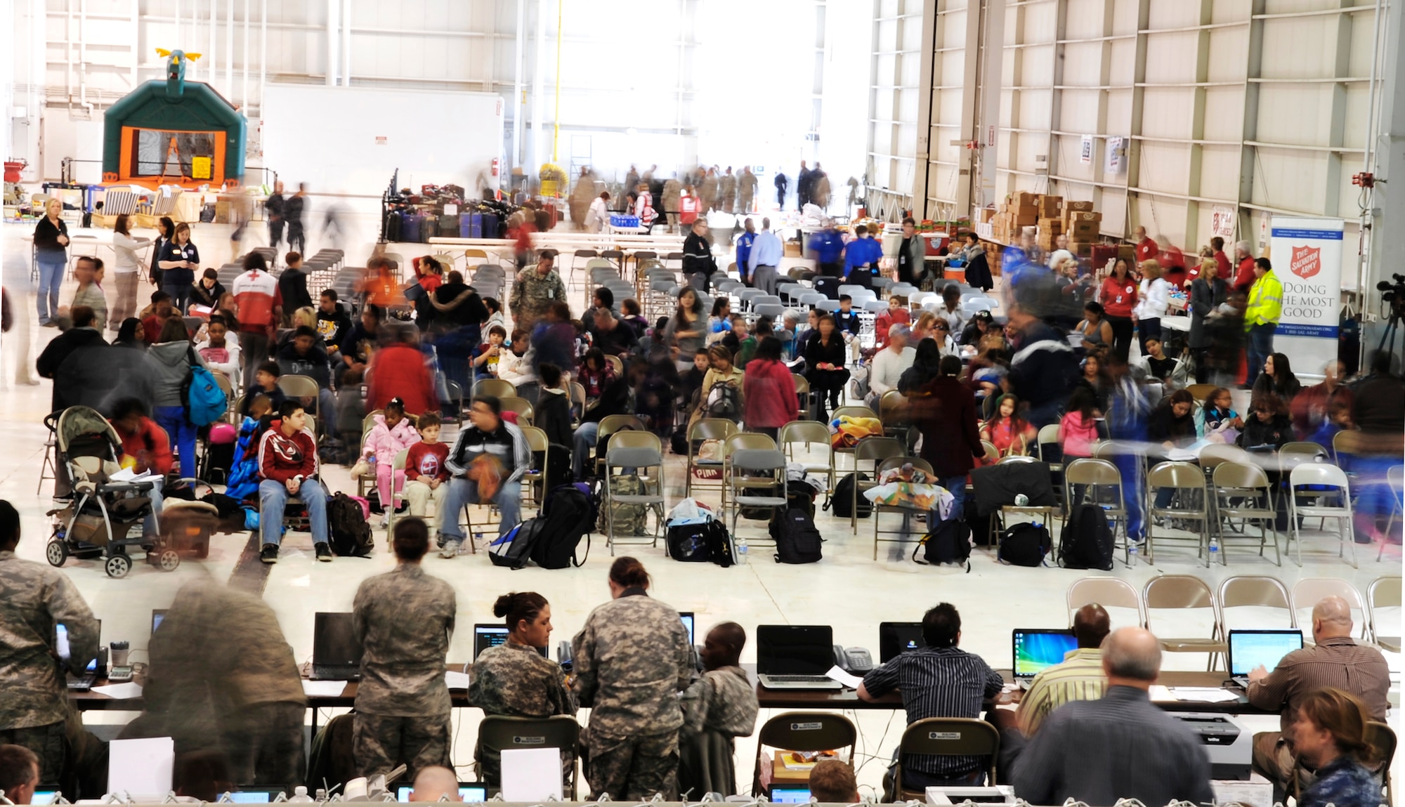 Military family members arriving from Japan begin their inprocessing March 24, 2011, in Denver. Family members voluntarily evacuated from Japan due to the recent natural disaster. (U.S. Air Force photo/Airman 1st Class Paul Labbe)