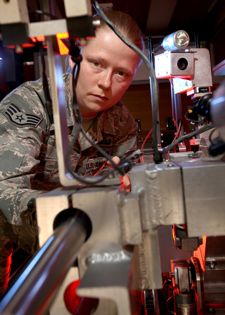 Staff Sgt. Molly Callen prepares an explosive ordnance disposal robot during a training exercise March 15. Robots allow EOD technicians to quickly eliminate potential hazards from an improvised explosive device without exposing EOD technicians to more threat than necessary. Sergeant Callen is an EOD technician with the 802nd Civil Engineer Squadron. (U.S. Air Force photo/Robbin Cresswell)