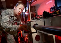 Staff Sgt. Molly Callen prepares an explosive ordnance disposal robot during a training exercise March 15. Robots allow EOD technicians to quickly eliminate potential hazards from an improvised explosive device without exposing EOD technicians to more threat than necessary. Sergeant Callen is an EOD technician with the 802nd Civil Engineer Squadron. (U.S. Air Force photo/Robbin Cresswell)