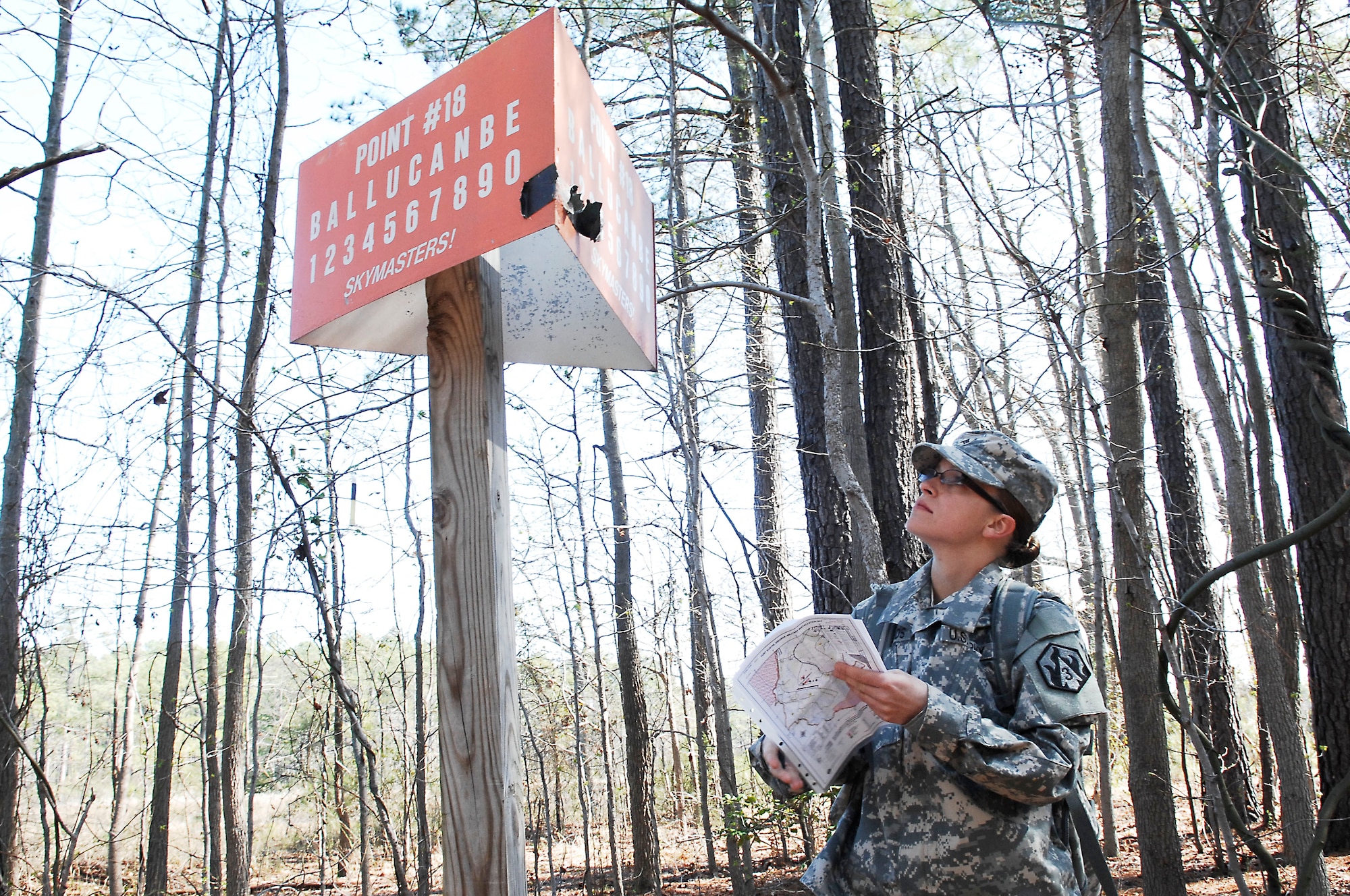 Army Sgt. Sarah Woods, a drill sergeant candidate with Charlie Company, 2nd Battalion, 417th Regiment, reads a coordinate point during the land navigation portion of the Best Warrior competition at Fort Eustis, Va., March 25, 2011.  Soldiers from various bases displayed their mental and physical capabilities to win Best Warrior in their division. (U.S. Air Force photo by Airman 1st Class Kayla Newman/Released)