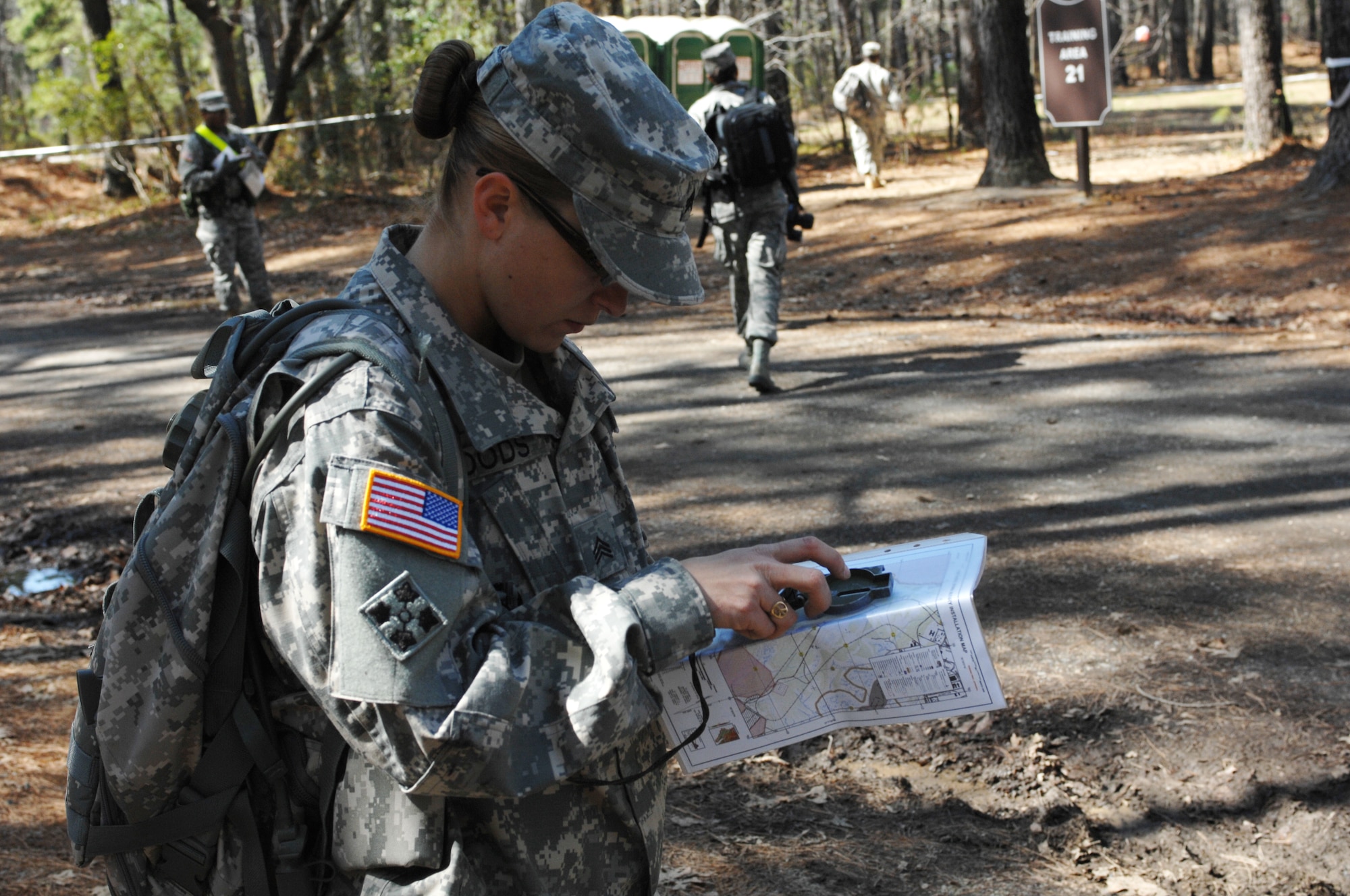 Army Sgt Sarah Woods, drill sergeant candidate with Charlie Company, 2nd Battalion, 417th Regiment, uses her compass to navigate through the land navigation portion of the Best Warrior competition at Fort Eustis, VA., March 25, 2011. Soldiers must navigate through combat environments to test their abilities and compete for the title of Best Warrior in their division. (U.S. Air Force photo by Airman 1st Class Teresa Zimmerman/Released)