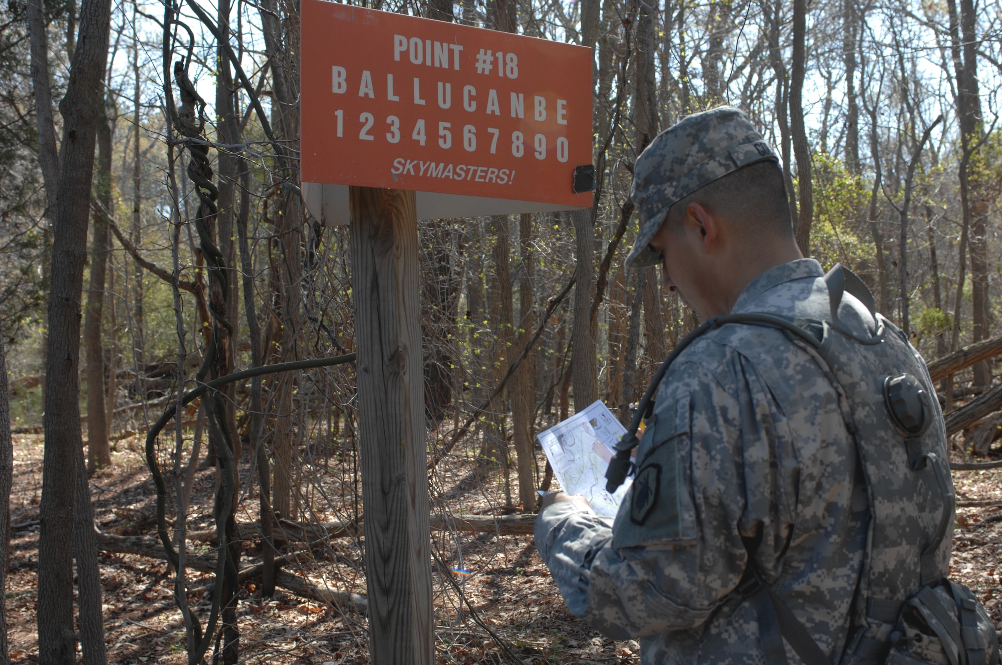 Army Spc Ricardo Colin, drill sergeant candidate with Alpha Company, 3rd Battalion, 318th Regiment, marks coordinate points during the land navigation portion of the Best Warrior competition at Fort Eustis, Va., March 25, 2011. Soldiers must navigate through combat environments to test their abilities and compete for the title of Best Warrior in their division. (U.S. Air Force photo by Airman 1st Class Teresa Zimmerman/Released)