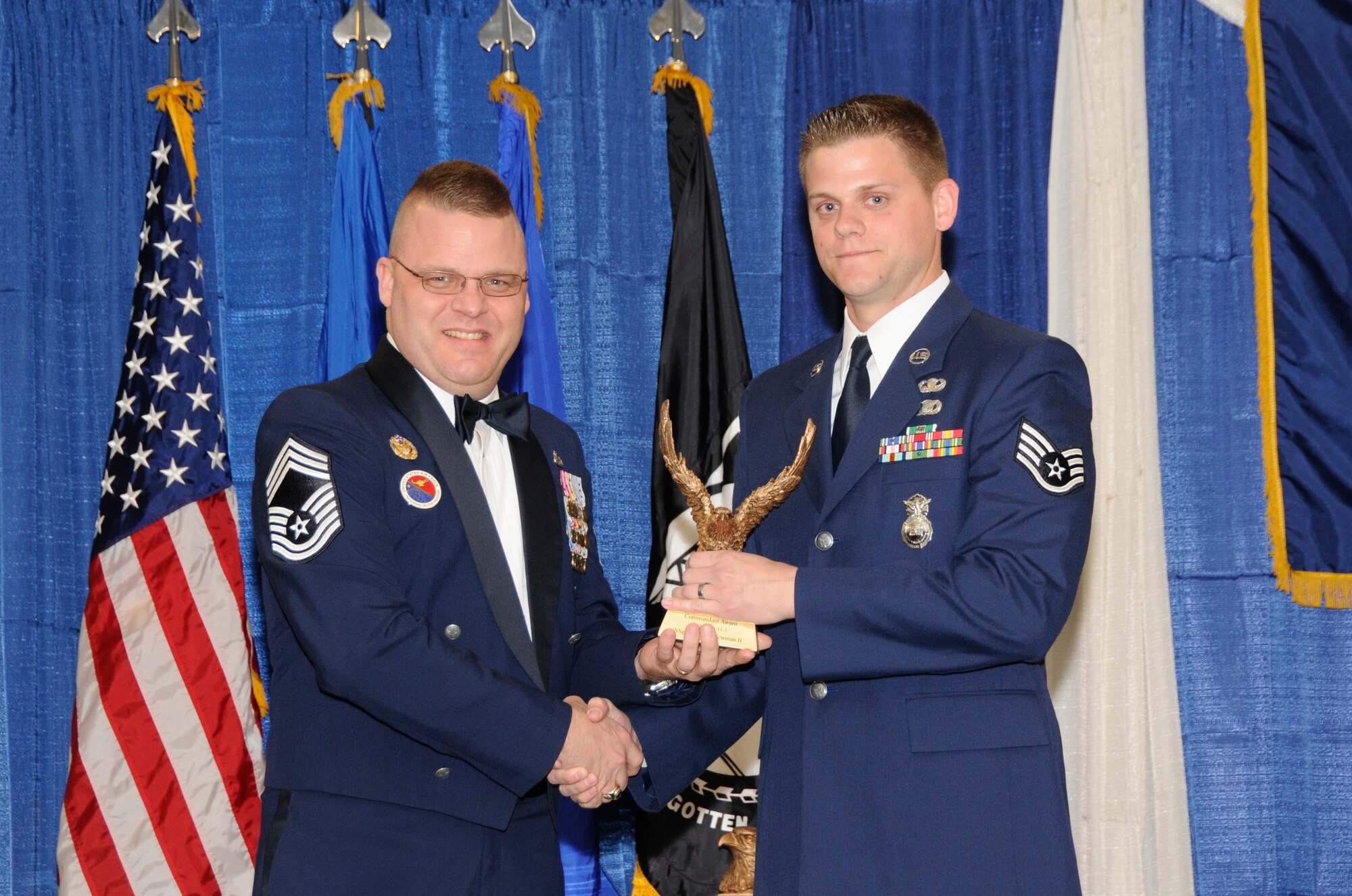 McGHEE TYSON AIR NATIONAL GUARD BASE, Tenn. - Staff Sgt. James C. Newman, right, a security forces journeyman with the North Carolina Air National Guard, receives the Paul H. Lankford leadership award for Airman Leadership School Class 11-3 at The I.G. Brown Air National Guard Training and Education Center from Chief Master Sgt. Donald Felch, EPME commandant, March 14, 2011.  The leadership award is presented to the student who made the most significant contribution to the overall success of the class by demonstrating superior leadership abilities and excellent skills as a team member.  It is named in honor of CMSgt Paul H. Lankford, a Bataan Death March survivor and the first commandant of the Air National Guard Enlisted Professional Military Education Center.  (U.S. Air Force photo by Master Sgt. Kurt Skoglund/Released)
