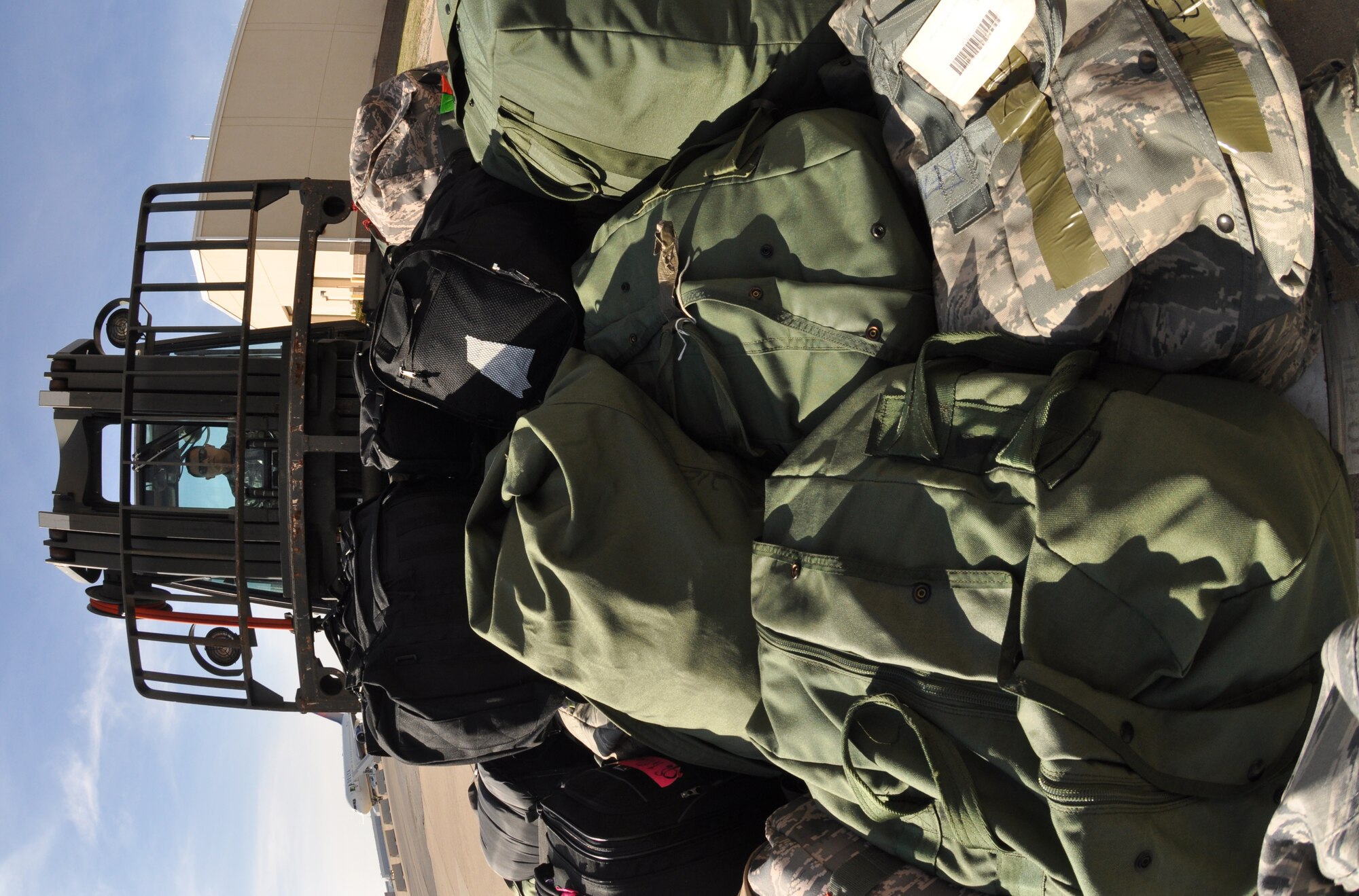 Tech. Sgt. Ruben Arellano picks up a pallet of baggage with a 10K-standard forklift March 6 at Naval Air Station Fort Worth Joint Reserve Base, Texas.  Sergeant Arellano is an Air Force Reserve cargo supervisor in the 73rd Aerial Port Squadron.  The baggage was headed to an overseas location along with a group of deploying Airmen.  (U.S. Air Force photo/Lt. Col. David Kurle)