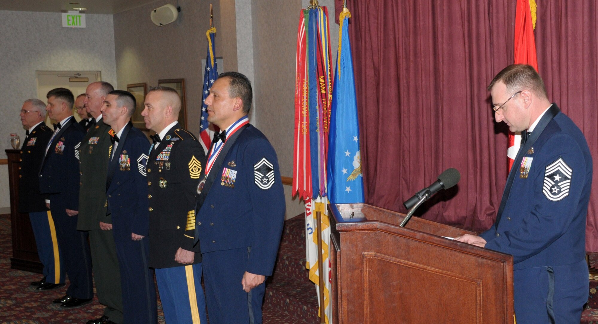 Chief Master Sgt. Marty Anderson, 90th Missile Wing command chief introduces Command Sergeant Major Robert Winney, 2/300th Field Artillery CSM, Chief Master Sgt. (sel.) David John, 90th Security Forces Squadron, Sergeant Major Ross Burback, 2/300th FA operations SGM, Chief Master Sgt. (sel.) Shawn Drinkard, 790th Missile Security Forces, Command Sgt. Major Harold Pafford, Training Site Command Post CSM at Guernsey, and Chief Master Sgt. (sel.) Julio Perez, 15th Munitions Squadron, during Warren’s Chief Master Sergeant and Sergeants Major recognition in the Trail’s End Club March 19. (U.S. Air Force photo by Blaze Lipowski)