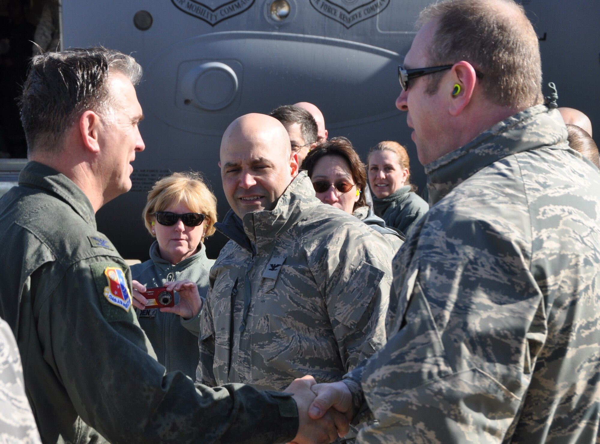 JOINT BASE MCGUIRE-DIX-LAKEHURST, N,J - Col. Giordano McMullen, 514th Air Mobility Wing commander, receives farewell wishes from wing members as he exits a C-17 Globemaster III,  March 25, after landing from his final flight. Colonel McMullen retires from the Air Force Reserve on March 27 after 30 years of service. (U.S. Air Force photo/Master Sgt. Donna T. Jeffries)