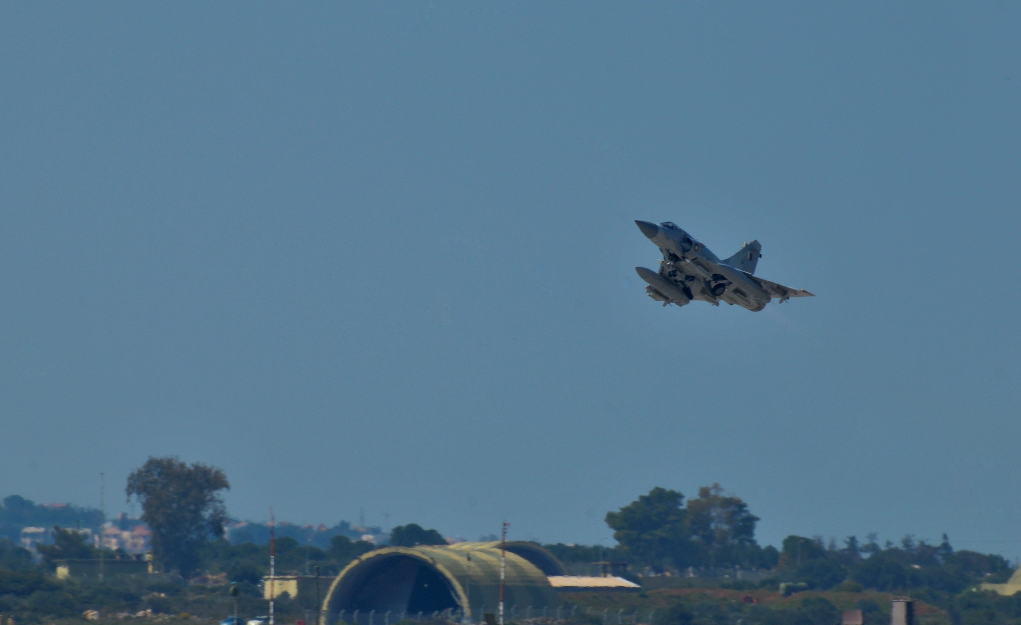 SOUDA BAY, Greece -- A Qatar Emiri Air Force Dassault Mirage 2000-5 fighter jet takes off as part of a Joint Task Force Odyssey Dawn mission. Joint Task Force Odyssey Dawn is the U.S. Africa Command task force established to provide operational and tactical command and control of U.S. military forces supporting the international response to the unrest in Libya and enforcement of United Nations Security Council Resolution (UNSCR) 1973. UNSCR 1973 authorizes all necessary measures to protect civilians in Libya under threat of attack by Qadhafi regime forces. JTF Odyssey Dawn is commanded by U.S. Navy Adm. Samuel J. Locklear, III. (U.S. Navy Photo by Paul Farley/Released)
