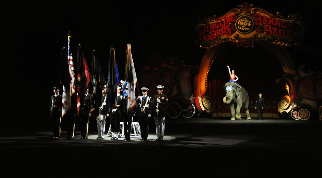 Members of the Military District of Washington Joint Service Honor Guard present the colors before the beginning of the Ringling Brothers and Barnum & Bailey Circus March 24 at the Verizon Center, Washington, D.C.  The show was a salute to military heroes, with many wounded warriors from Walter Reed Army Medical Center and their families in attendance. (U.S. Air Force photos by Senior Airman Torey Griffith)
