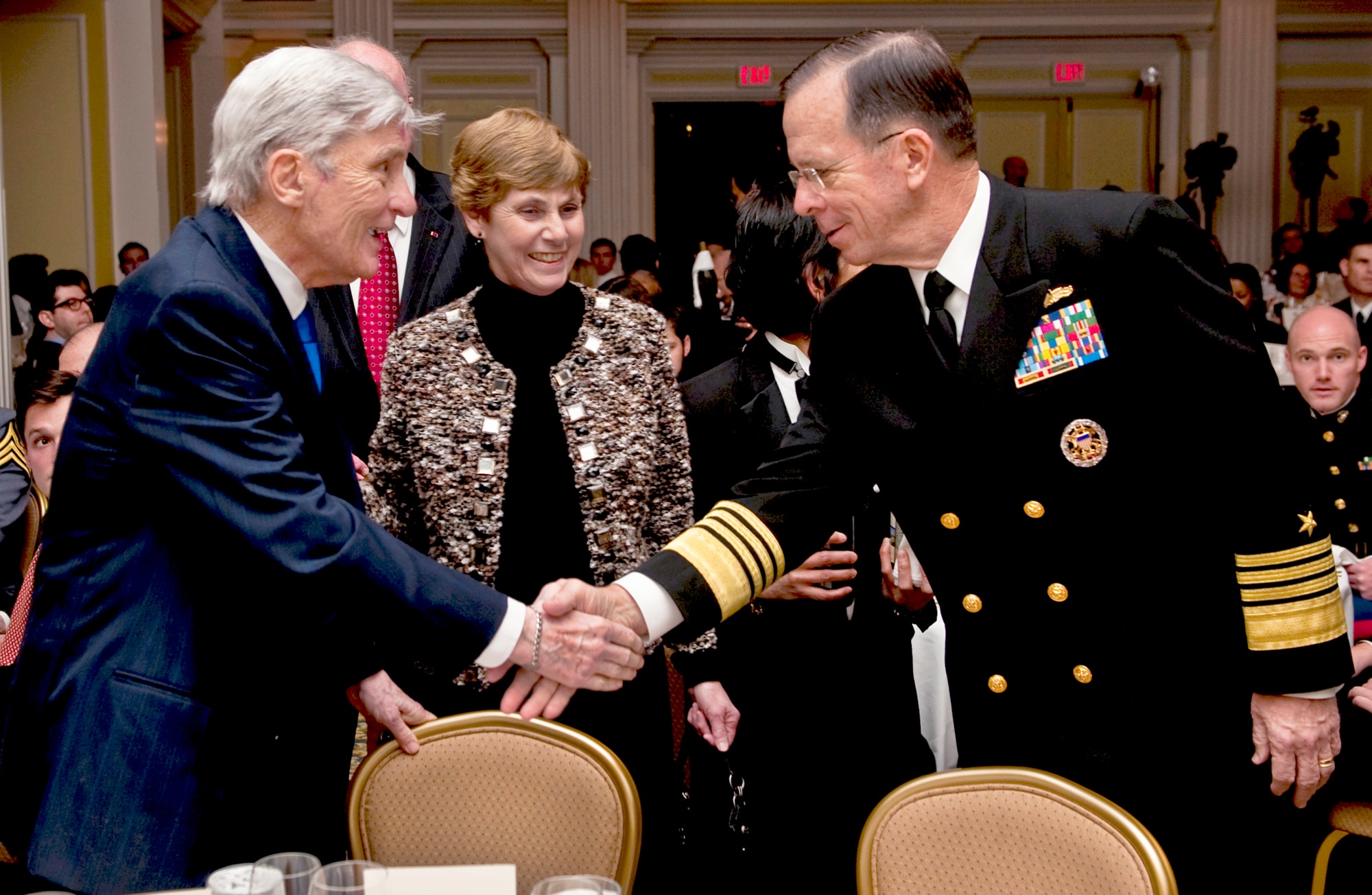 Navy Adm. Mike Mullen and his wife, Deborah, greet retired Sen. John W. Warner of Virginia at the Center for the Study of the Presidency and Congress awards dinner March 24, 2011, in Washington, D.C. Mullen accepted the Dwight D. Eisenhower Award for excellence on behalf of the U.S. Armed Forces at the dinner. Mullen is the chairman of the Joint Chiefs of Staff.(DOD photo/Navy Petty Officer 1st Class Chad J. McNeeley)
