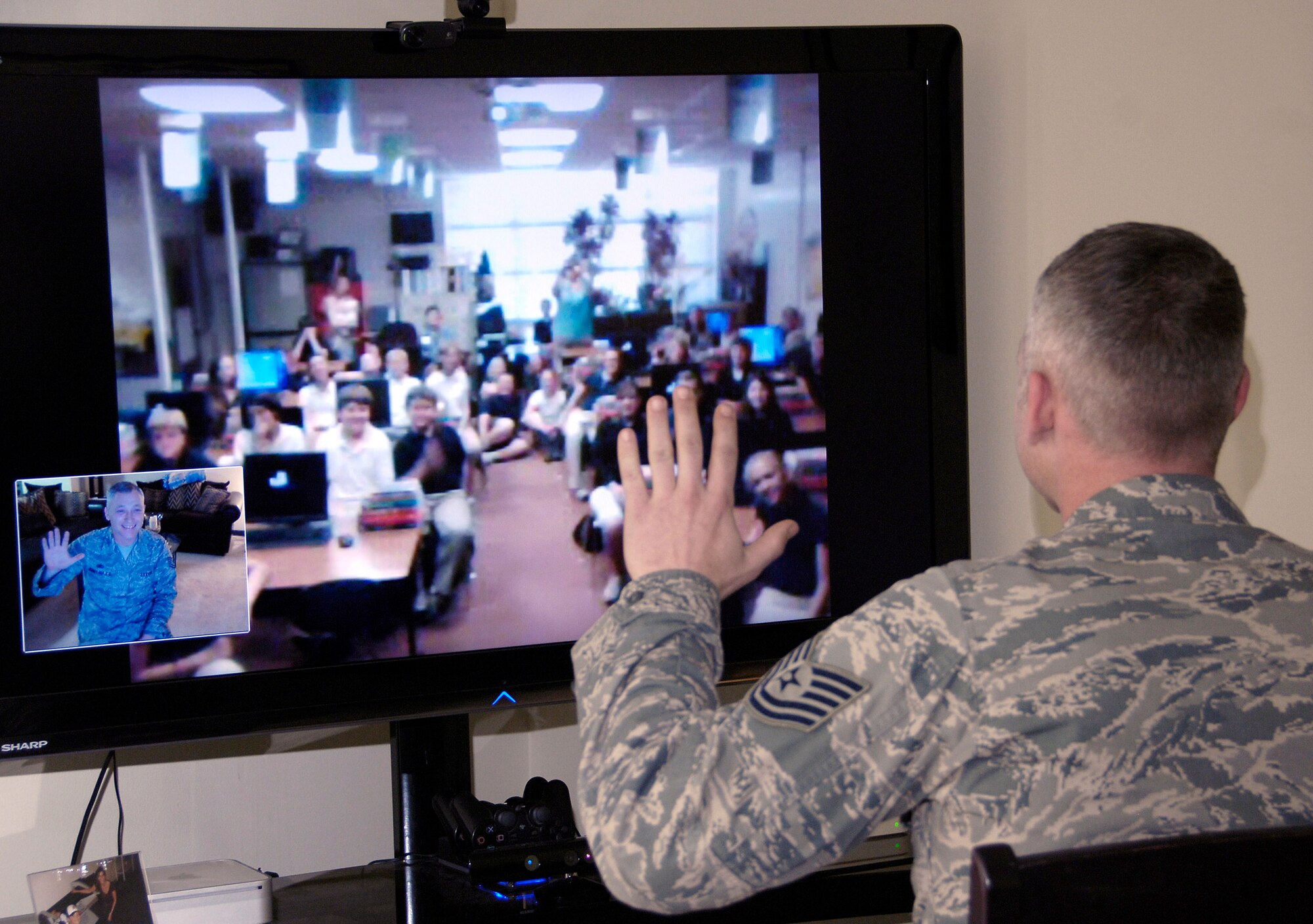 Tech. Sgt. Jason Myers waves to sixth graders at Elsanor Elementary School in Robertsdale, Ala., after a video teleconference March 25, 2011, to discuss Operation Tomodachi. Their teacher, Jeff Rhodus, had been discussing with his class the recent natural disasters in Japan. Sergeant Myers' son, Miland, is in the class and suggested they talk to his dad since he's stationed at Yokota Air Base, Japan. Sergeant Myers is a structural maintainer with the 374th Maintenance Squadron. (U.S. Air Force photo/Staff Sgt. J.G. Buzanowski)