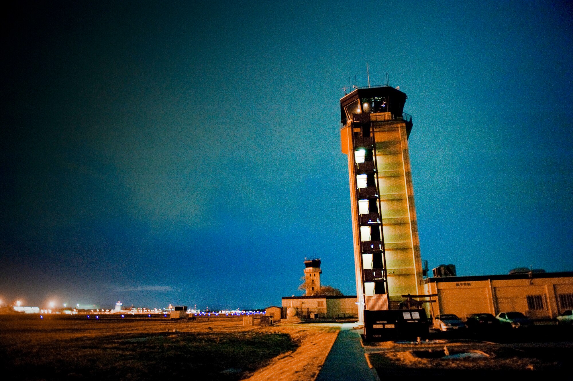 The air traffic controller tower overlooks the flightline March 24, 2011, at Yokota Air Base, Japan. Yokota's flight line has received over triple the normal amount of aircraft due to Operation Tomodachi.Yokota AB's flightline has received more than triple the normal amount of aircraft due to Operation Tomodachi. The military and civilian aircraft have been from multiple nations carrying supplies, personnel and equipment in direct support of bringing relief efforts and trying to minimize human suffering following an earthquake and tsunami March 11. (U.S. Air Force photo/Staff Sgt. Jonathan Steffen)