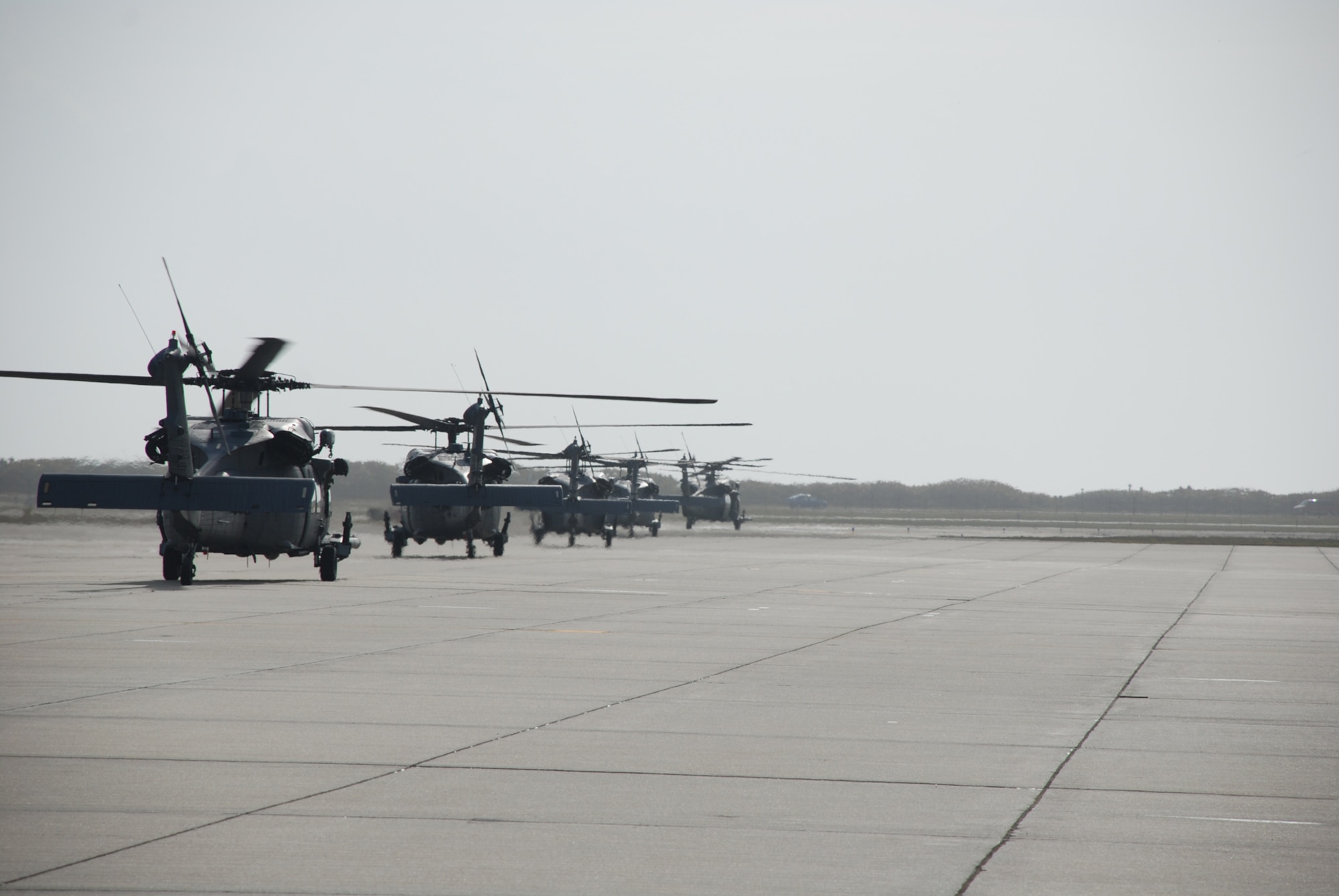 PATRICK AIR FORCE BASE, Fla. - Airmen line up in their HH-60G Pave Hawk helicopters from the 920th Rescue Wing here prior to take off March 6, along with the wing's entire fleet of six pave hawks and three HC-130 King refueling aircraft to prepare for hurricane evacuations and deployments. (U.S. Air Force photo/Capt. Ryan Liss)