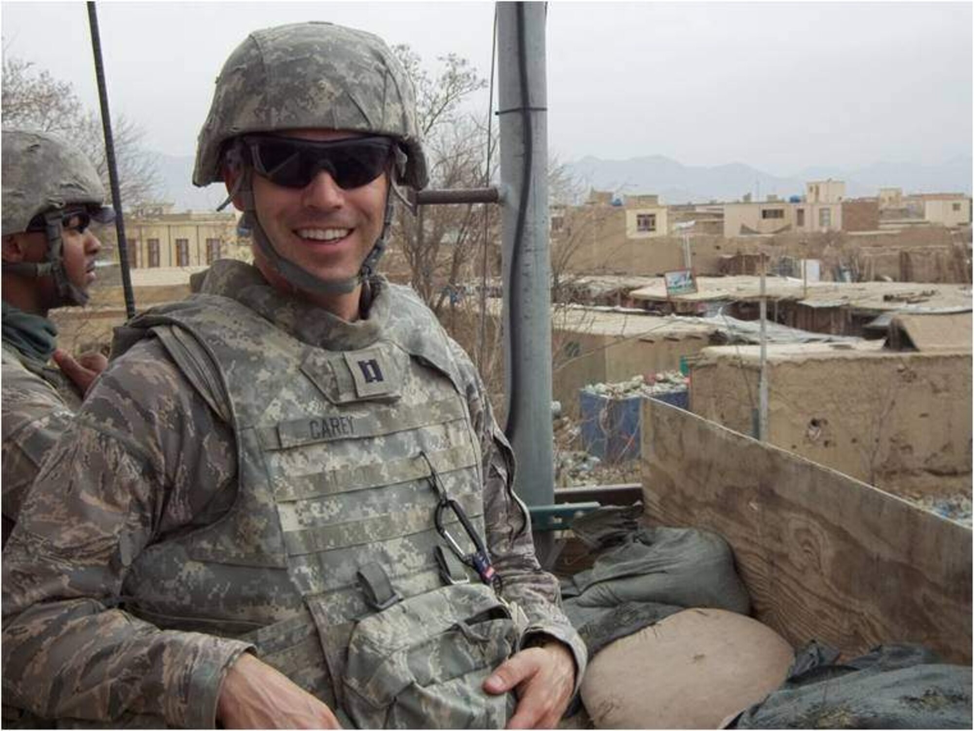 BAGRAM AIRFIELD, AFGHANISTAN -- Chaplian (Capt.) Michael Carey poses for a picture in a watch tower on Bagram Airfield, while visiting members of the 455th Expeditionary Security Forces Squadron. Chaplain Carey is assigned to the 455th ESFS to help deal the stresses of deployment and to increase morale. Chaplain Carey is deployed from Scott Air Force Base, Ill. (Courtesy Photo)