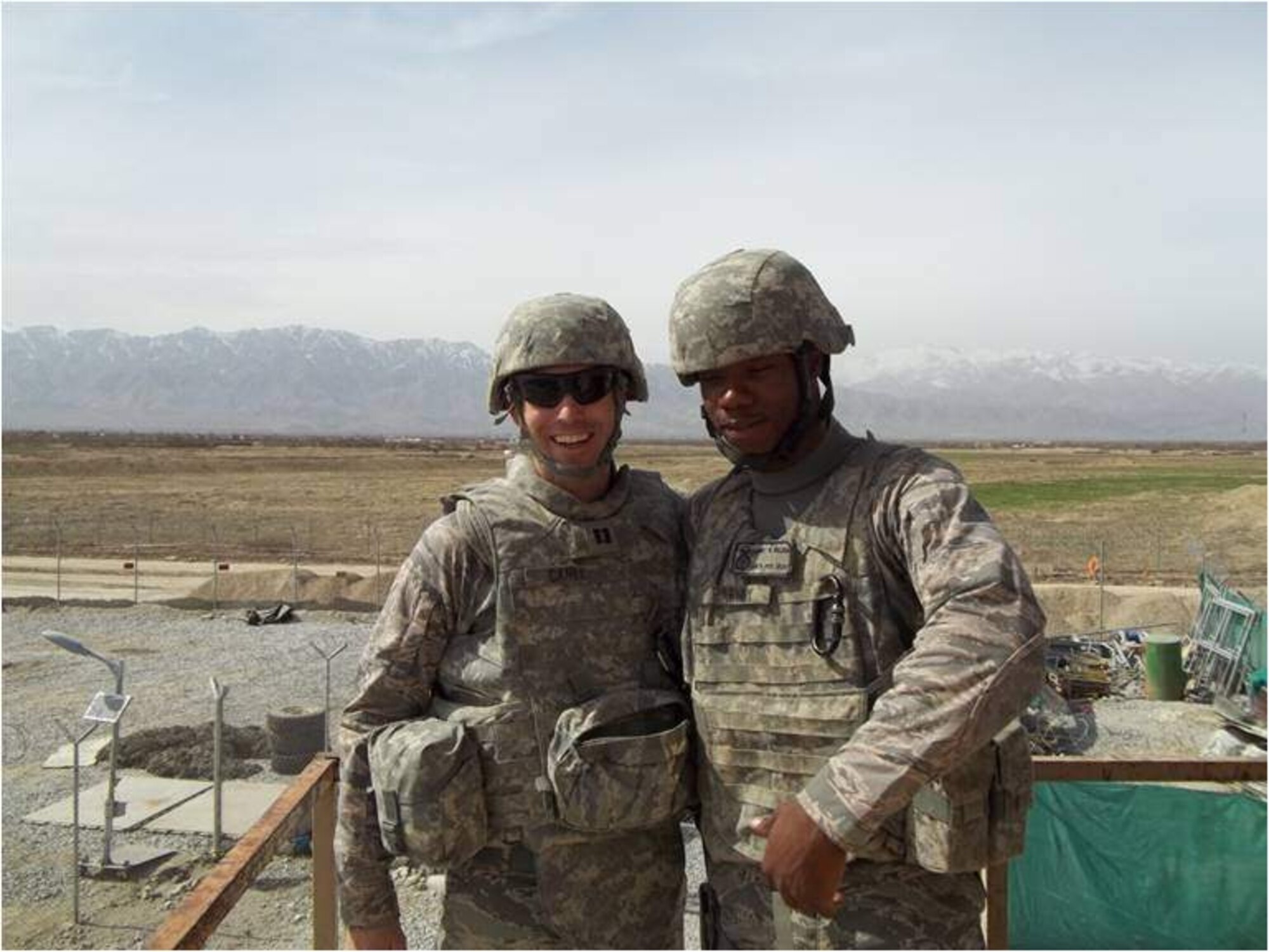 BAGRAM AIRFIELD, AFGHANISTAN -- Chaplian (Capt.) Michael Carey poses with a fellow Airmen from the 455th Expeditionary Security Forces Squadron. Chaplain Carey is assigned to the 455th ESFS to help deal the the stresses of deployment and to increase morale. Chaplain Carey is deployed from Scott Air Force Base, Ill. (Courtesy Photo)